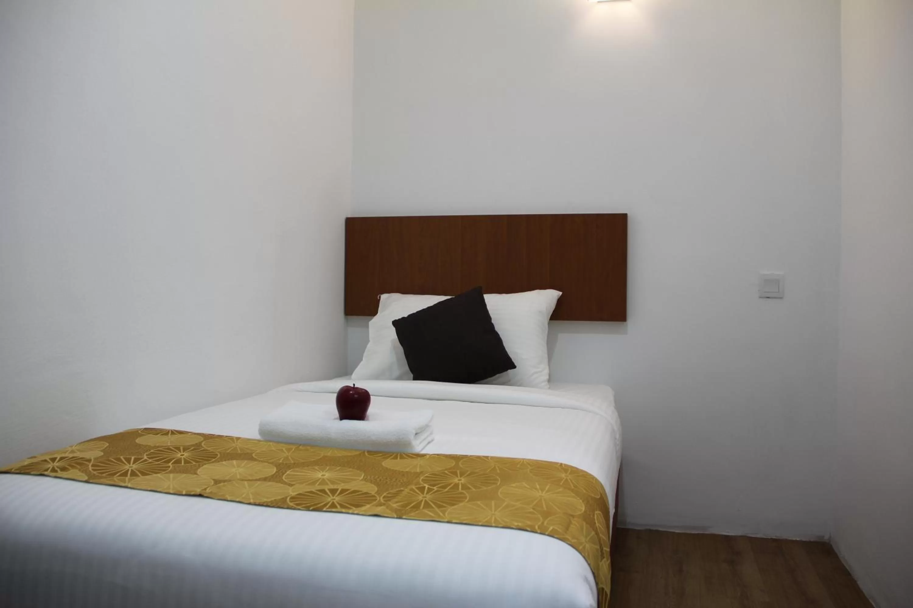 Bed in Big Apple Hotel