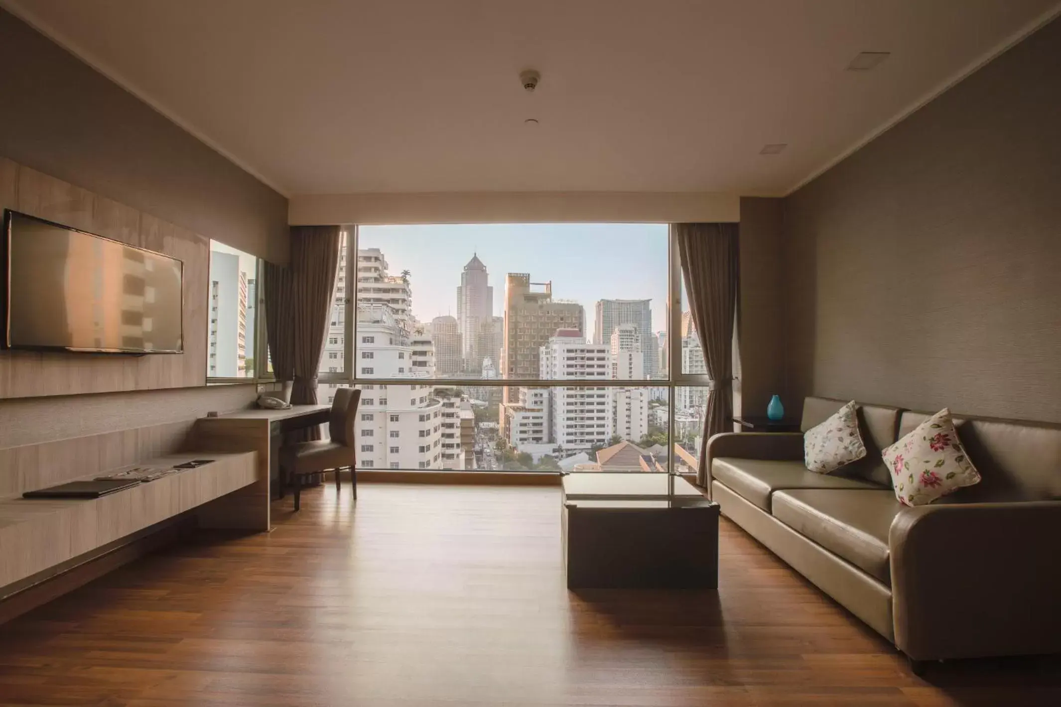 Living room in Adelphi Suites Bangkok - SHA Extra Plus
