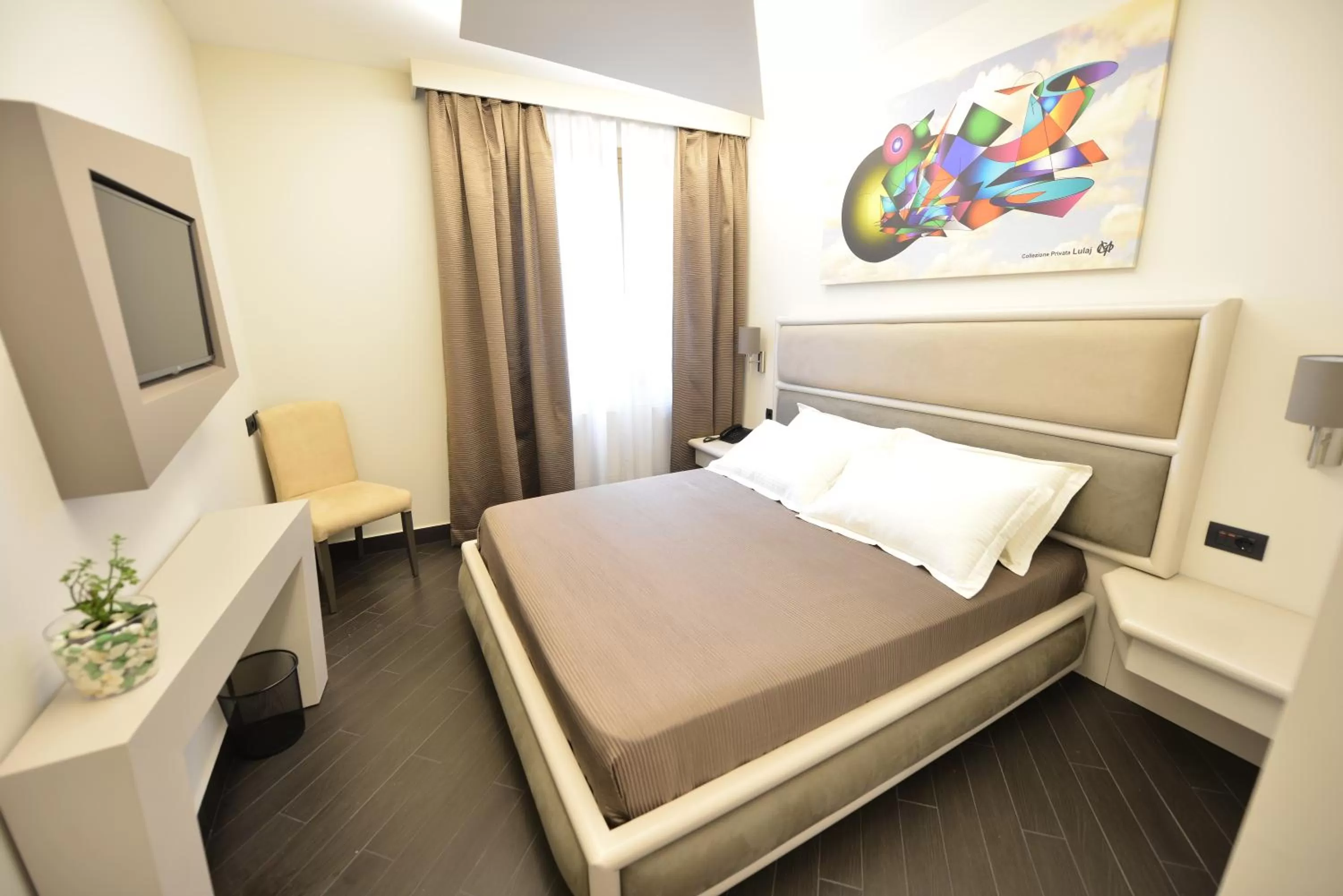 Bed in Petit Hotel Elita