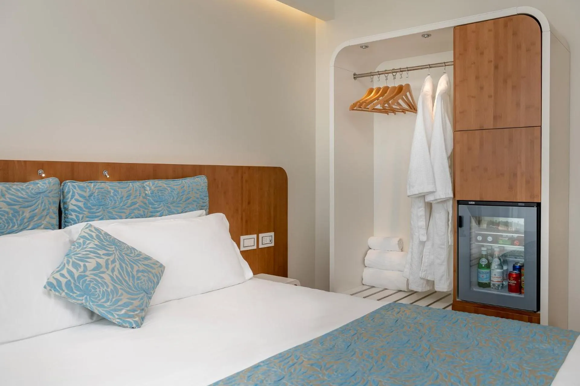 Bed in T-Suite Hotel