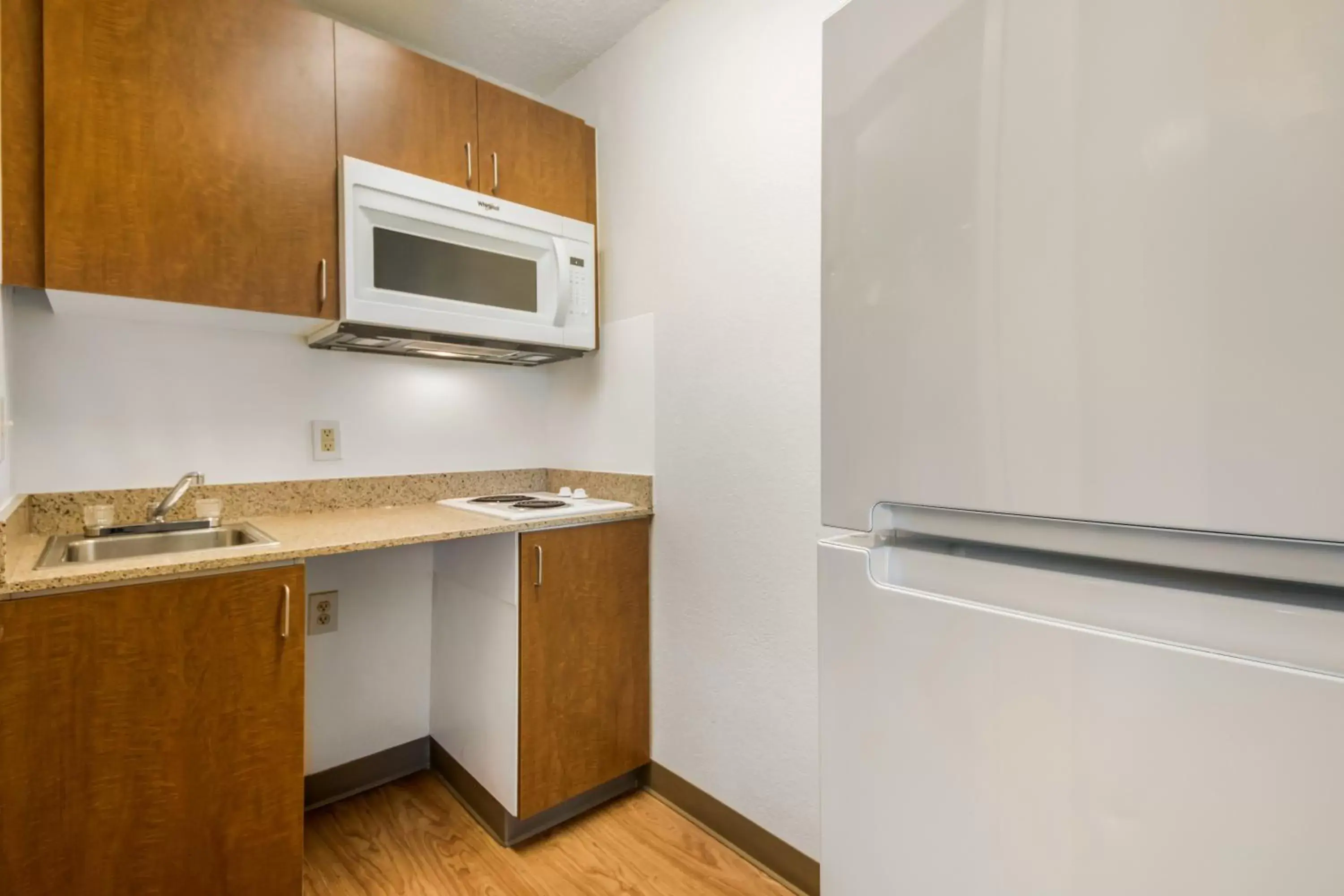 Photo of the whole room, Kitchen/Kitchenette in HomeTowne Studios by Red Roof Dallas - Mesquite