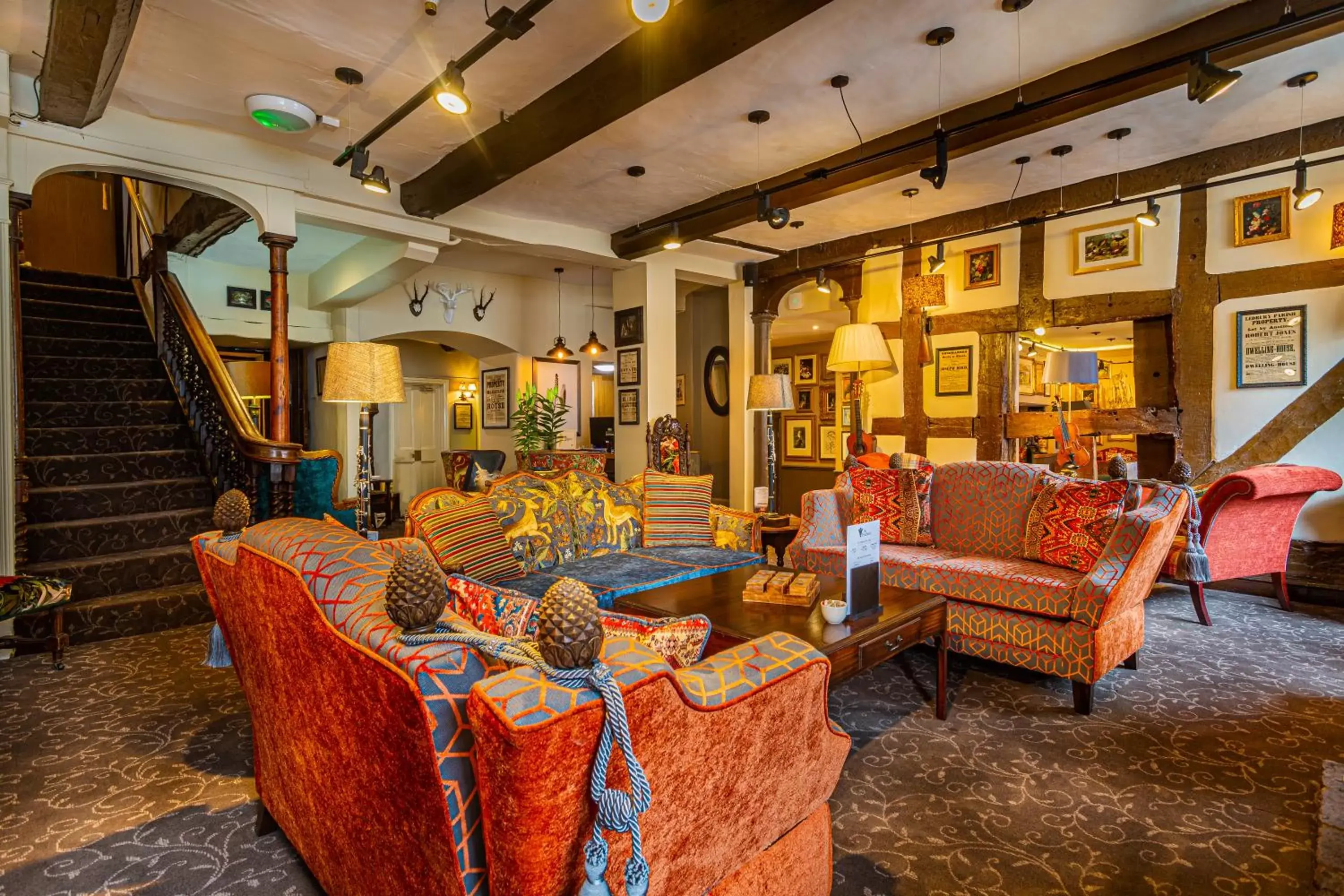Communal lounge/ TV room in The Feathers Hotel, Ledbury, Herefordshire