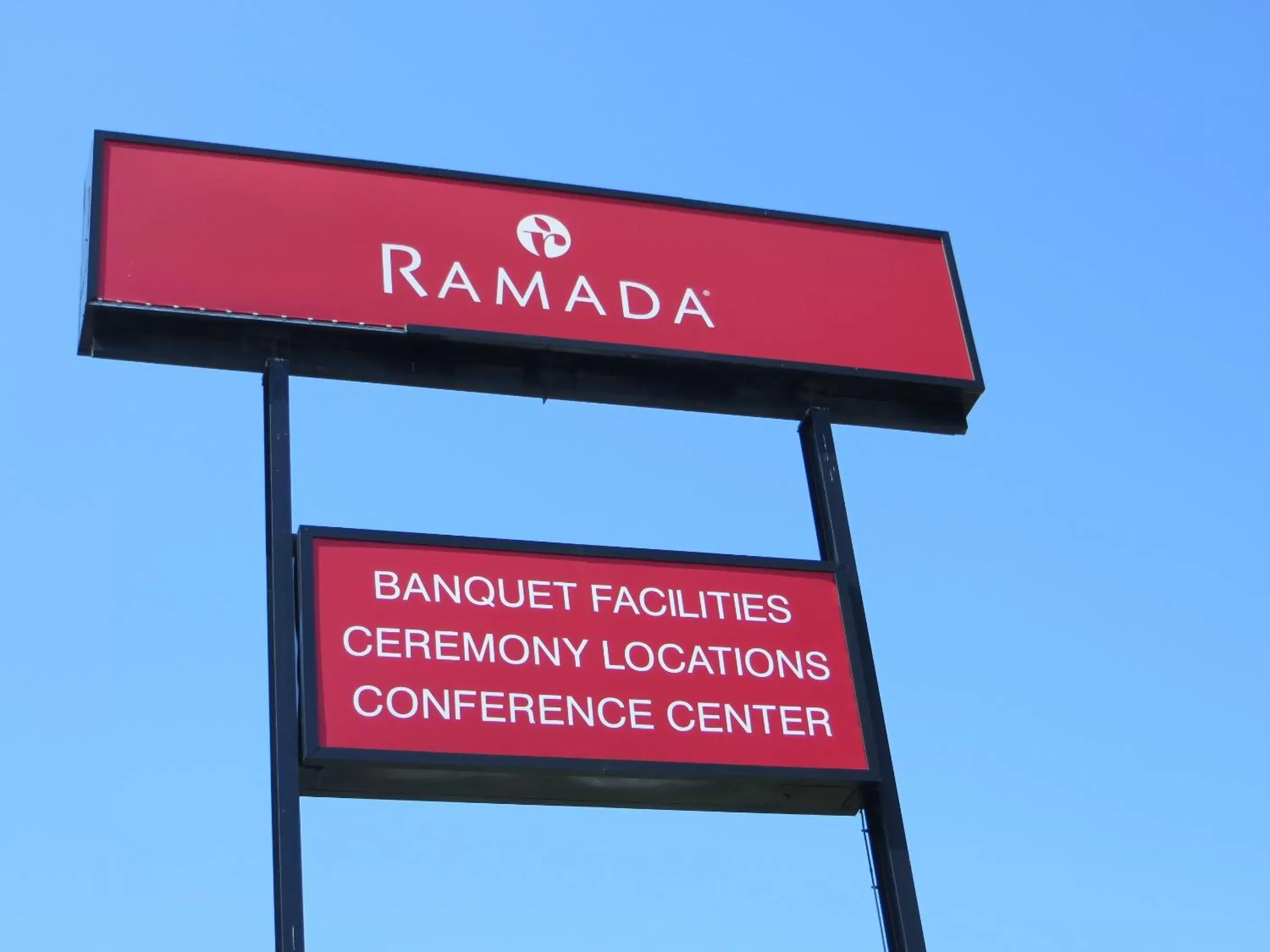 Property logo or sign in Ramada by Wyndham Lansing Hotel & Conference Center