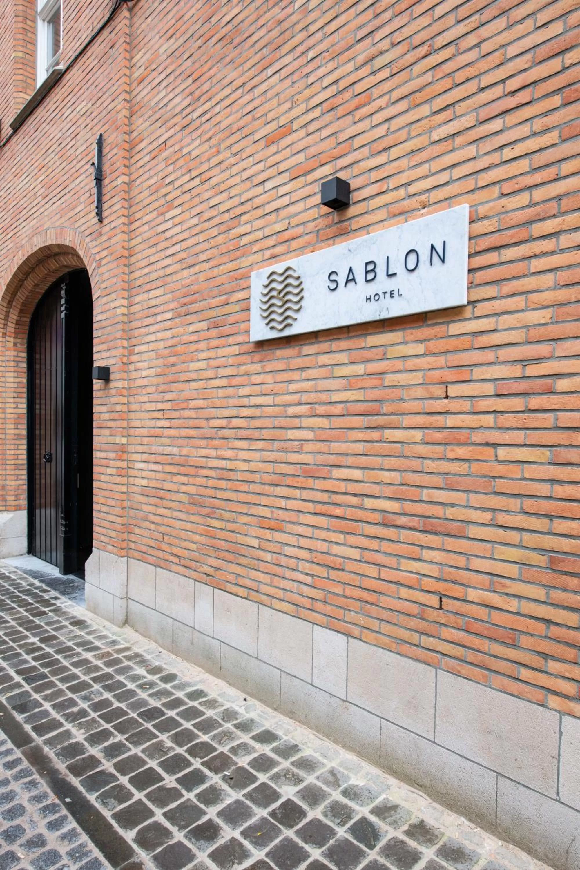 Property logo or sign in Boutique Hotel Sablon by CW Hotel Collection