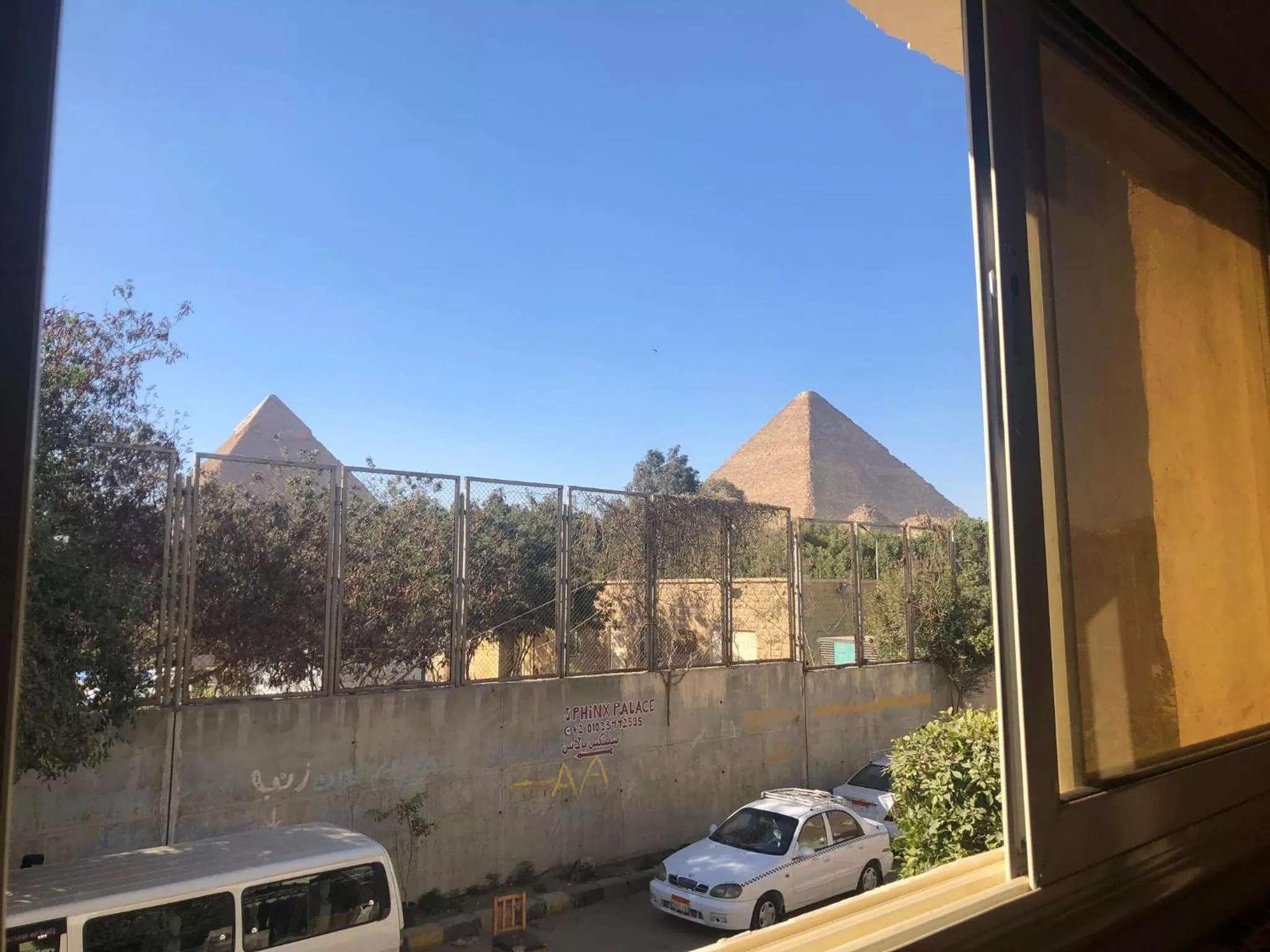Sphinx palace pyramids view