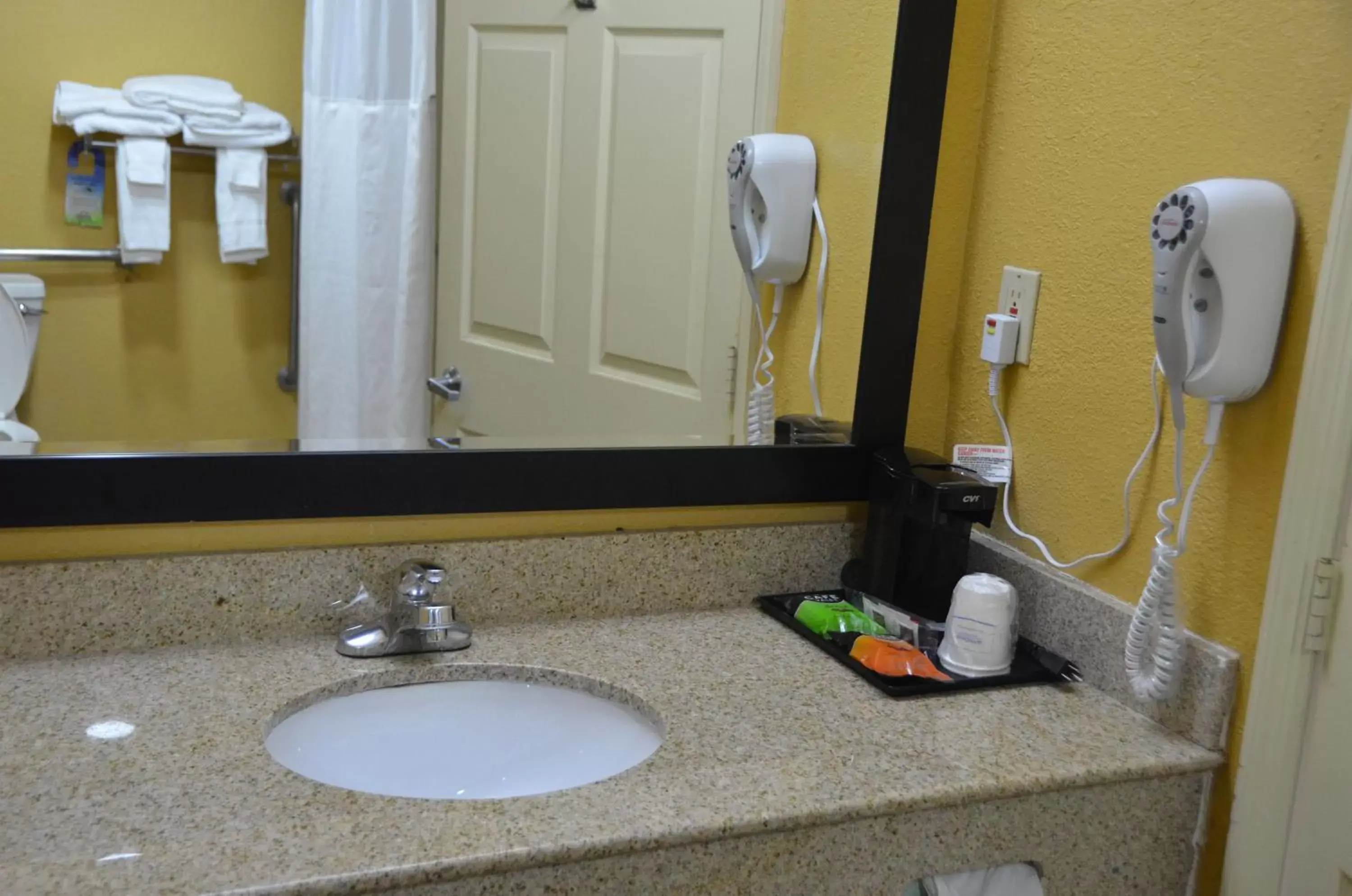 Bathroom in Days Inn by Wyndham Airport Nashville East