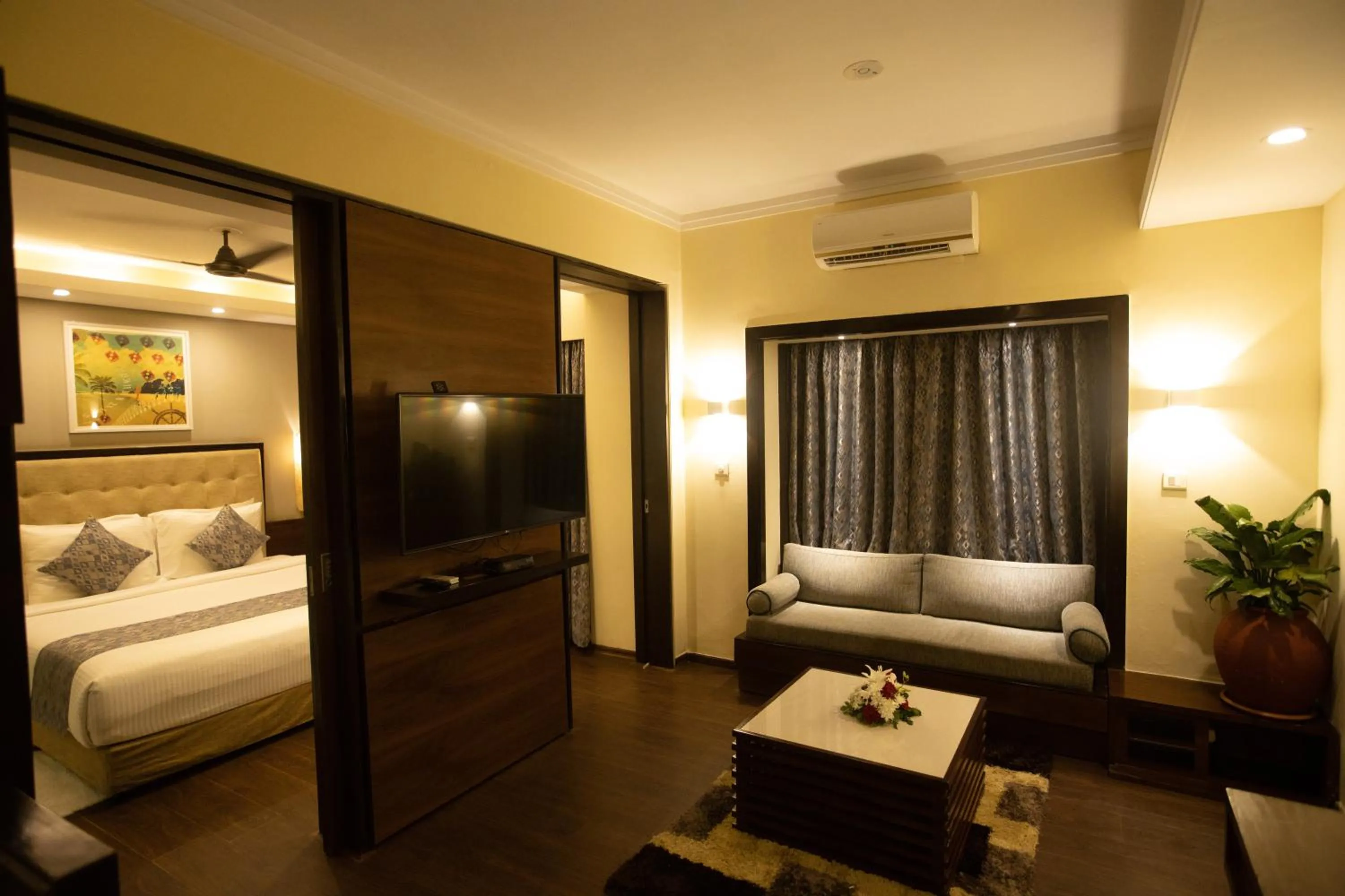 Seating area, Bed in Deltin Suites