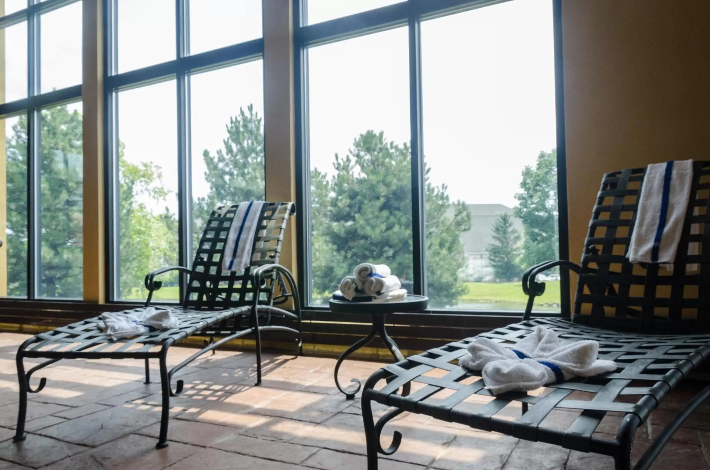 Swimming pool, Seating Area in Holiday Inn Hotel Pewaukee-Milwaukee West, an IHG Hotel