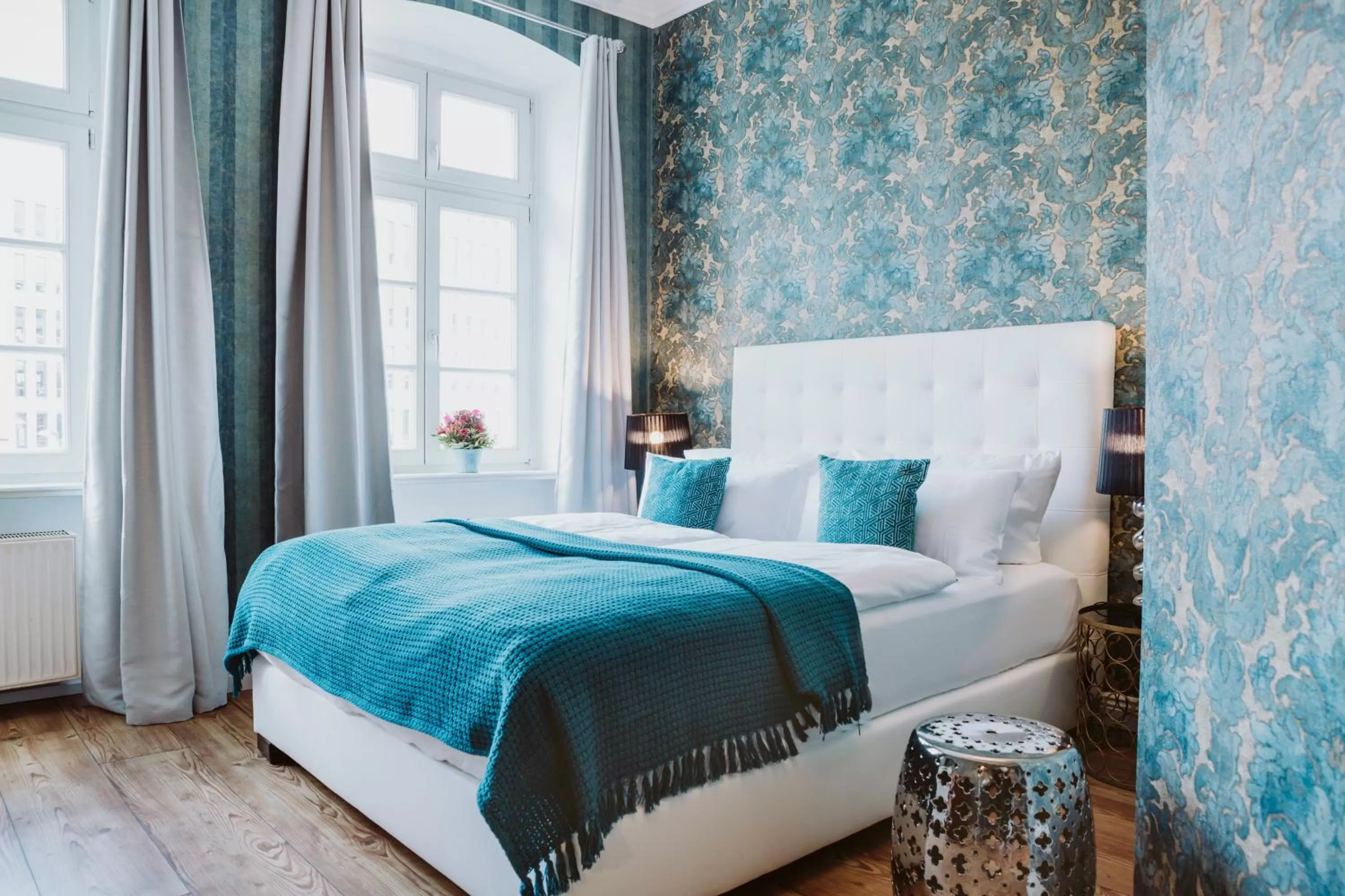 Bed in THE GATE GARDEN Hotel