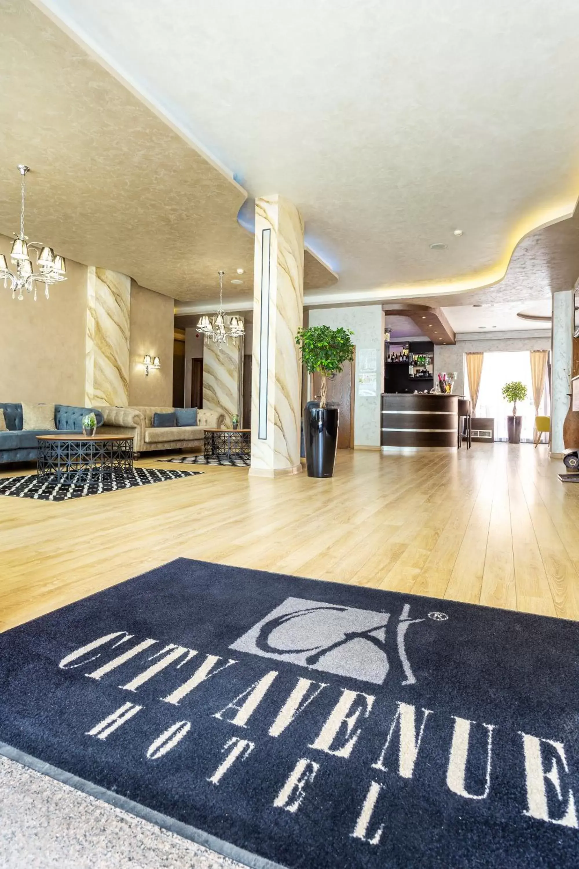 Lobby or reception in City Avenue Hotel by HMG