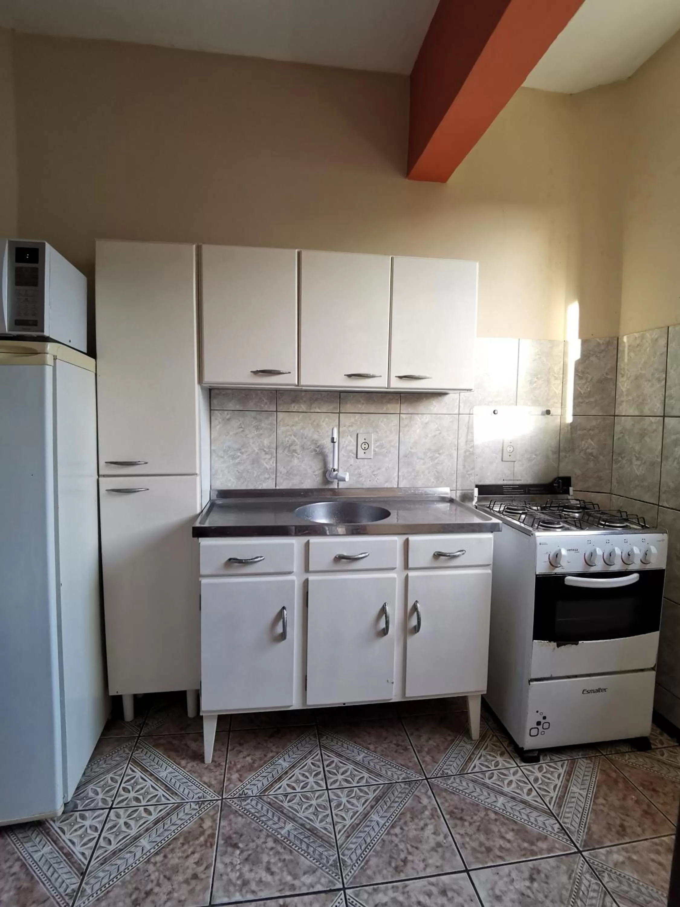 Kitchen or kitchenette in Apart da Cachoeira