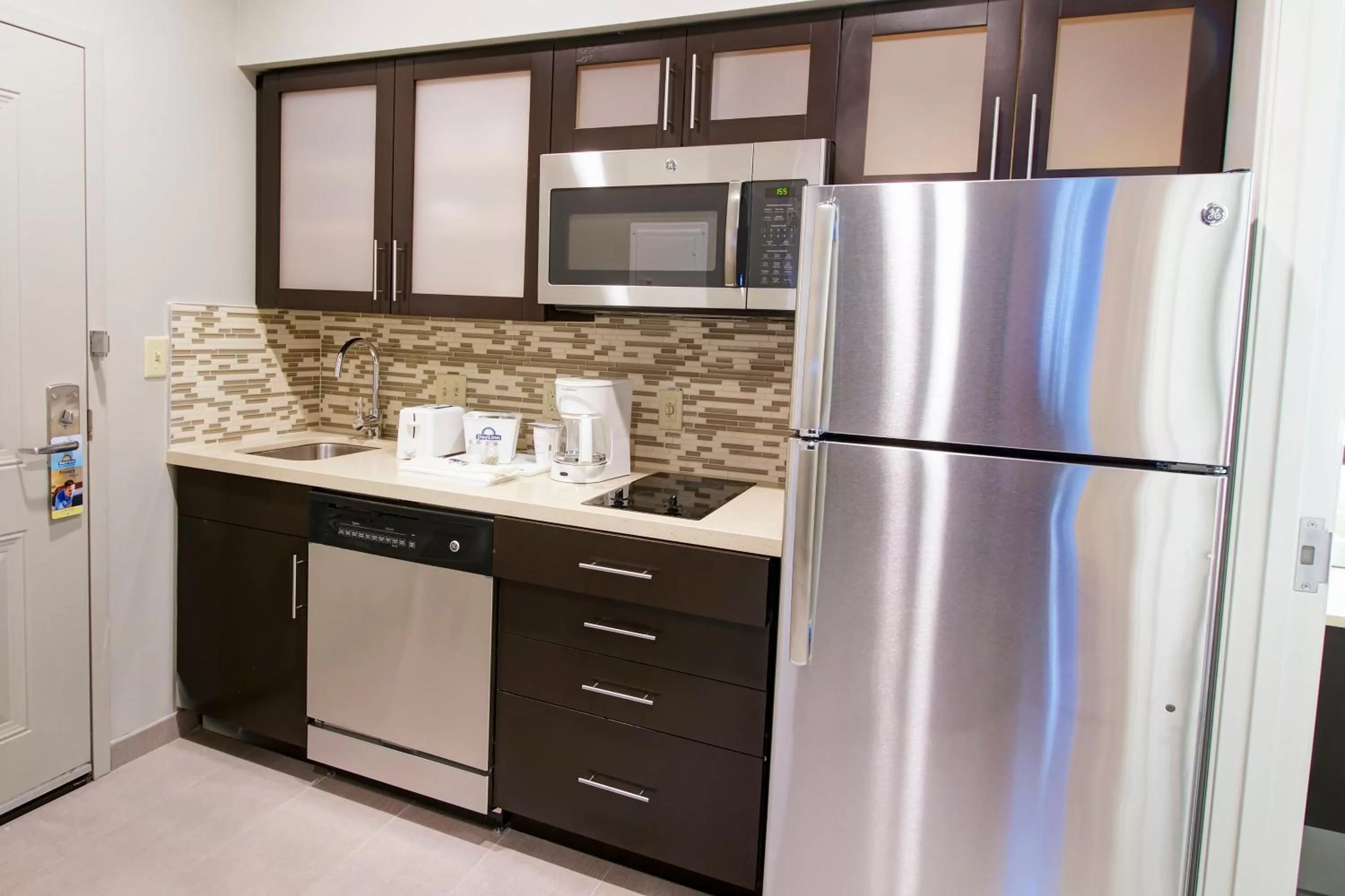 Kitchen or kitchenette in Days Inn & Suites by Wyndham Port Arthur