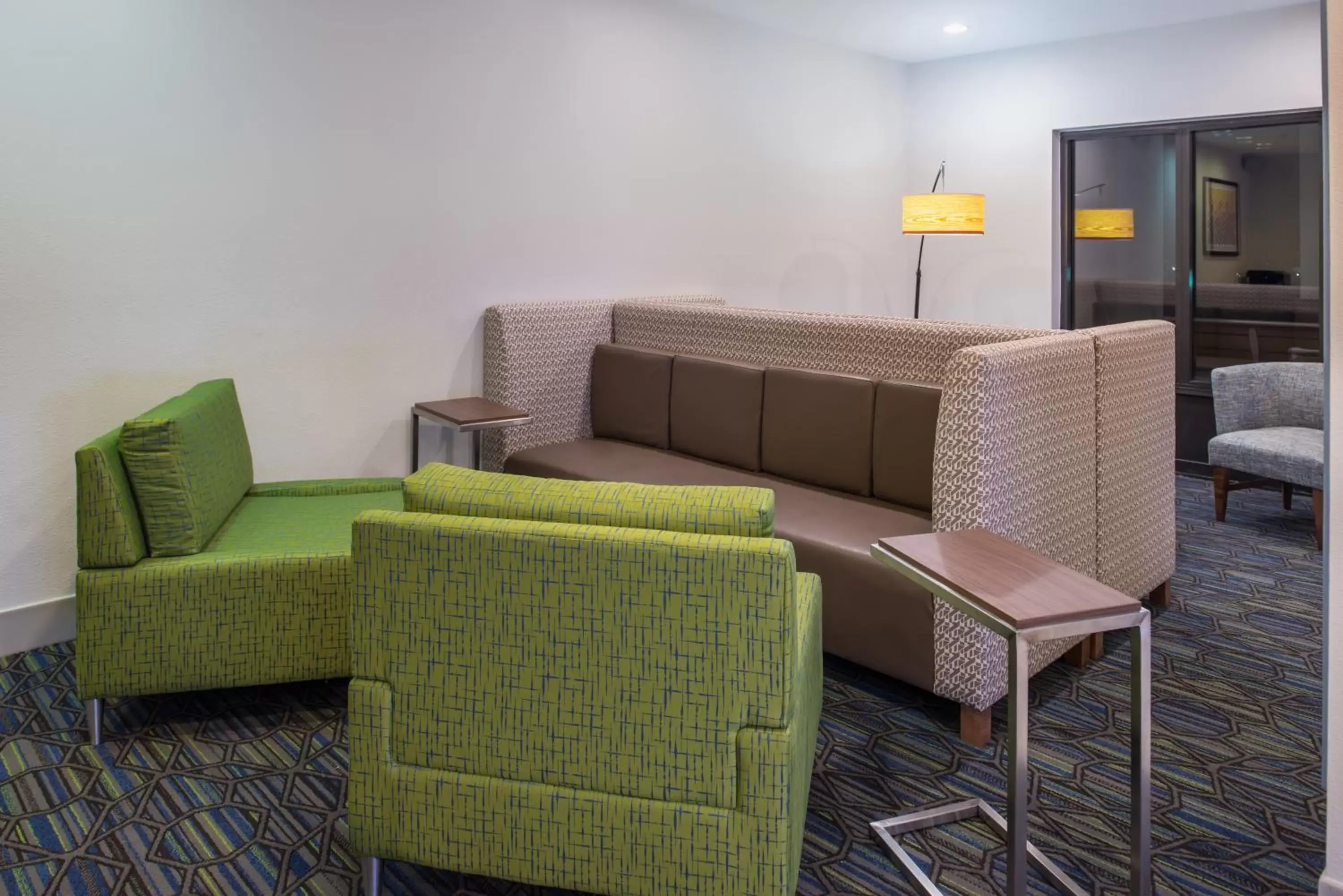 Property building, Seating Area in Holiday Inn Express Hotel & Suites Tampa-Anderson Road-Veterans Exp, an IHG Hotel