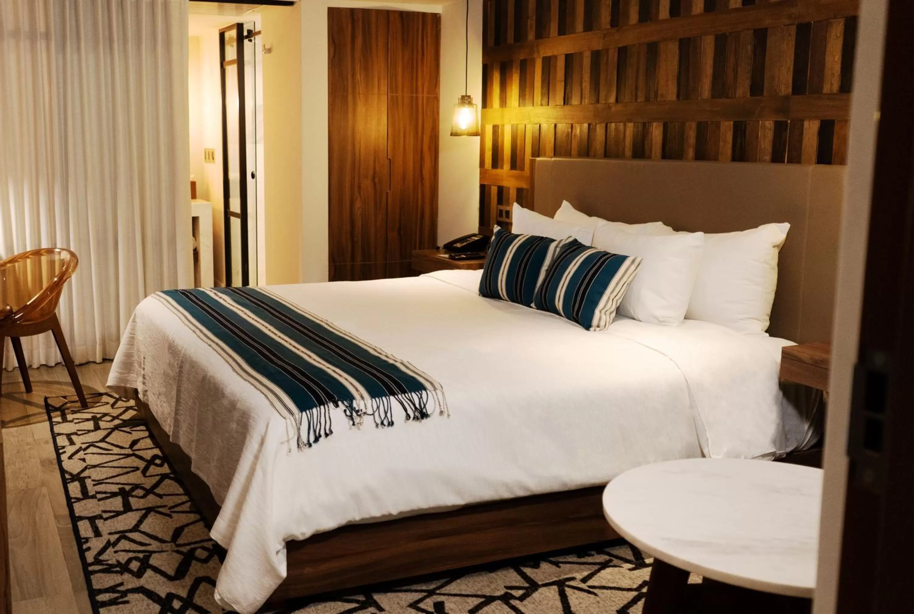 Bed in Hotel Indigo Guadalajara Expo by IHG