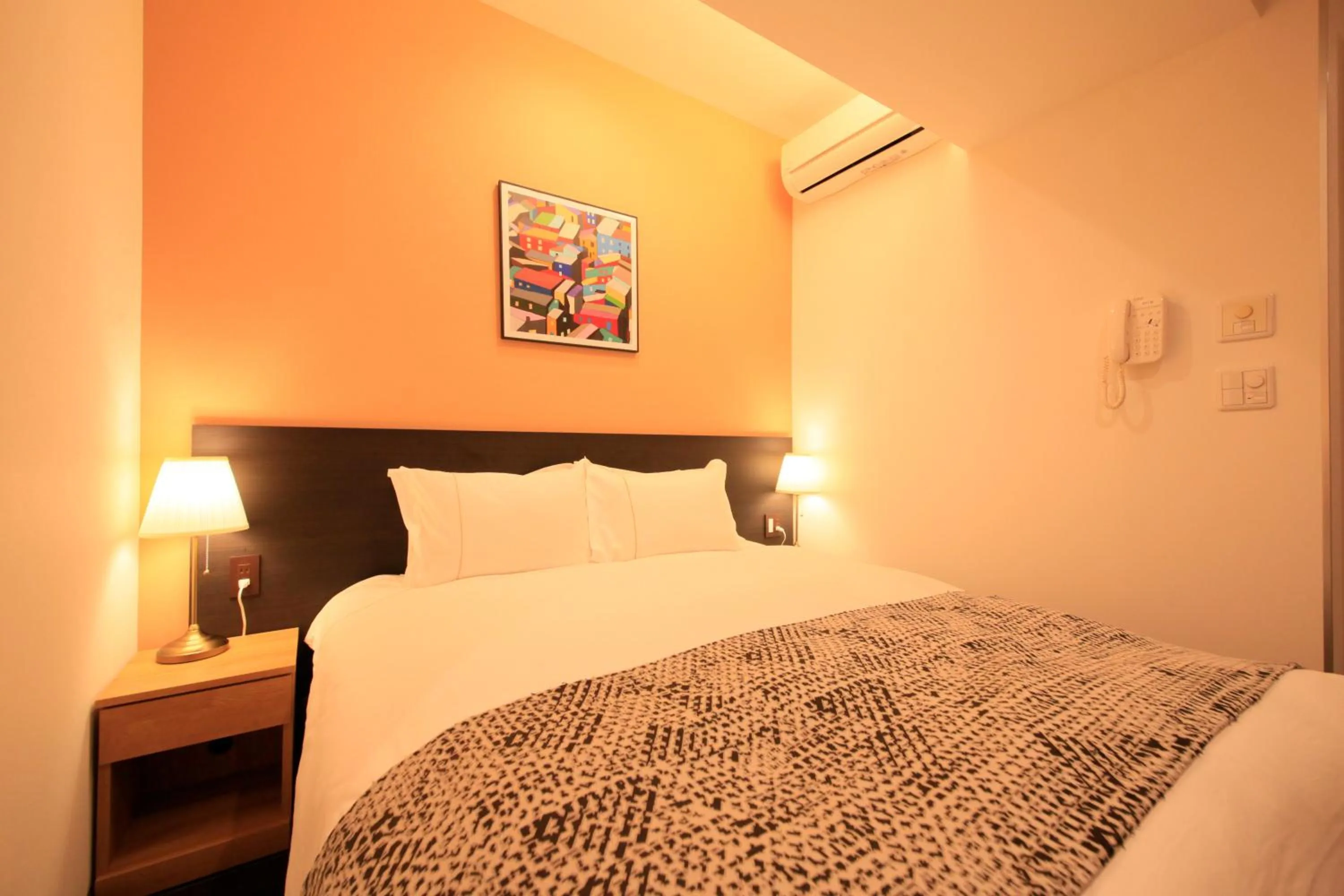 Photo of the whole room, Bed in Centurion Hotel Residential Akasaka Station