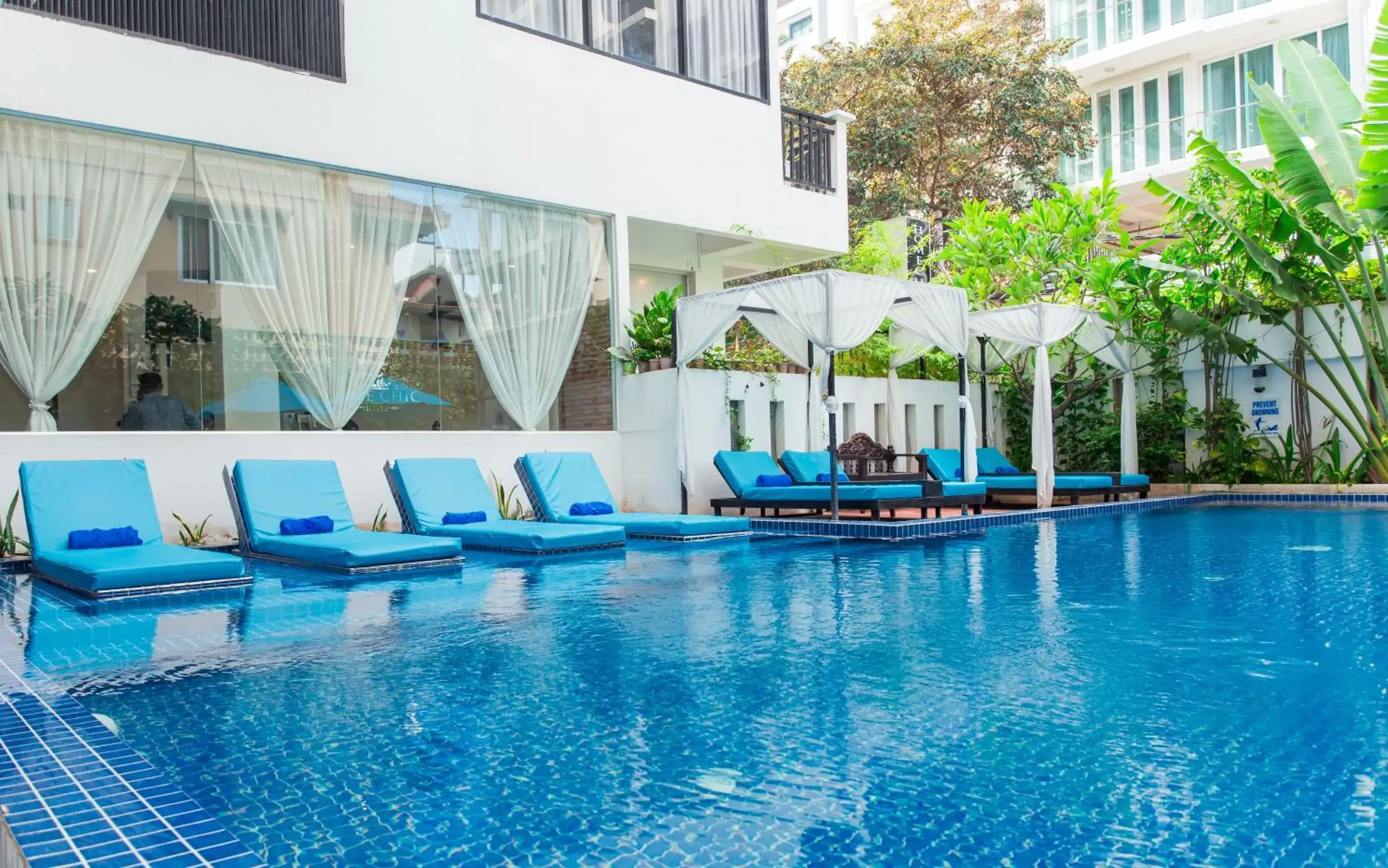 Property building, Swimming Pool in Home Chic Hotel