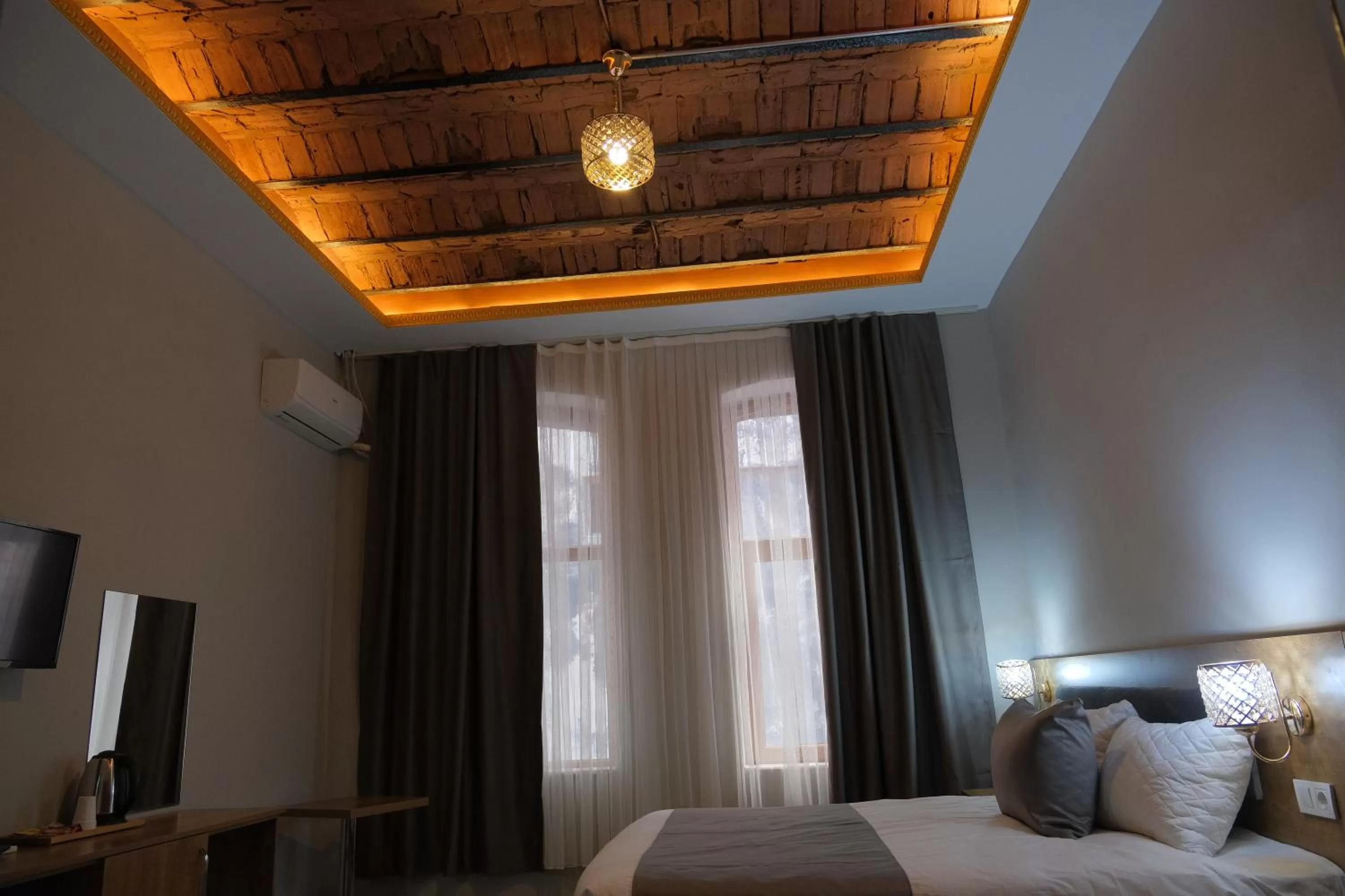 Bed in Adamantides Hotel