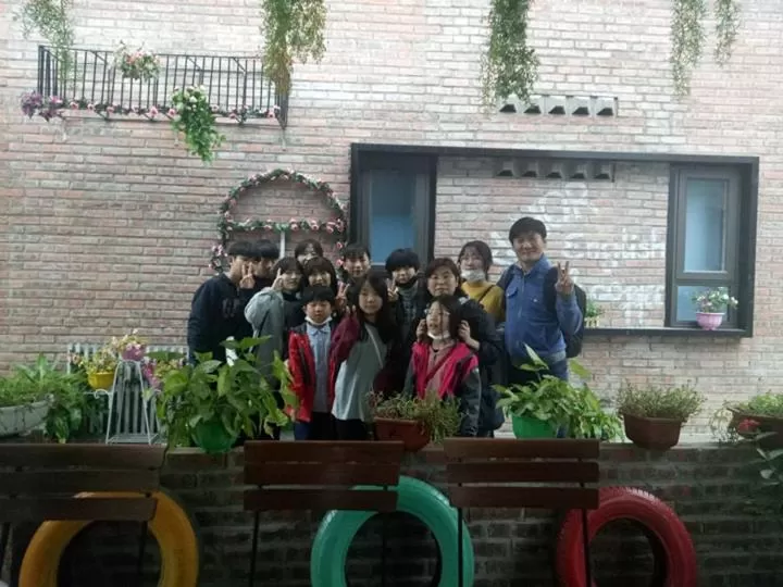 group of guests in Almor Hostel With Pool in right center