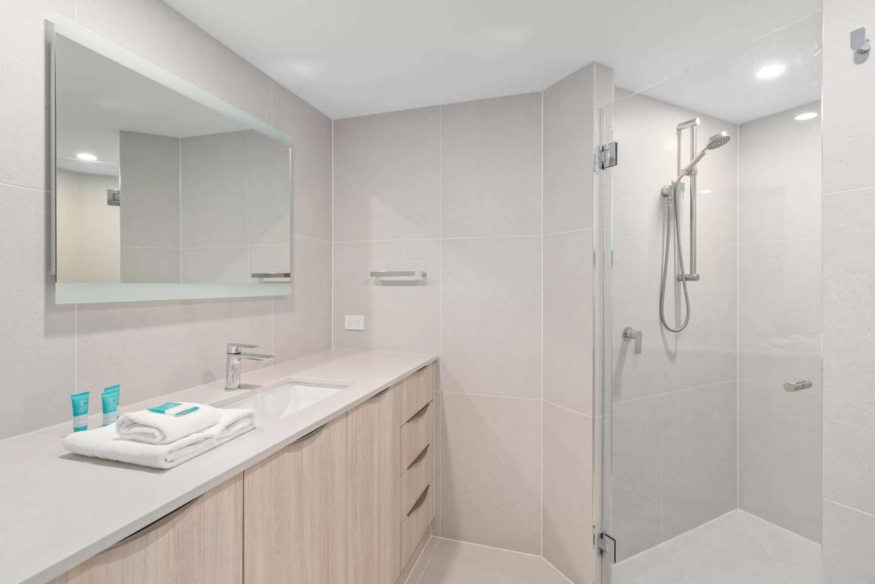 Shower in 84 The Spit Holiday Apartments