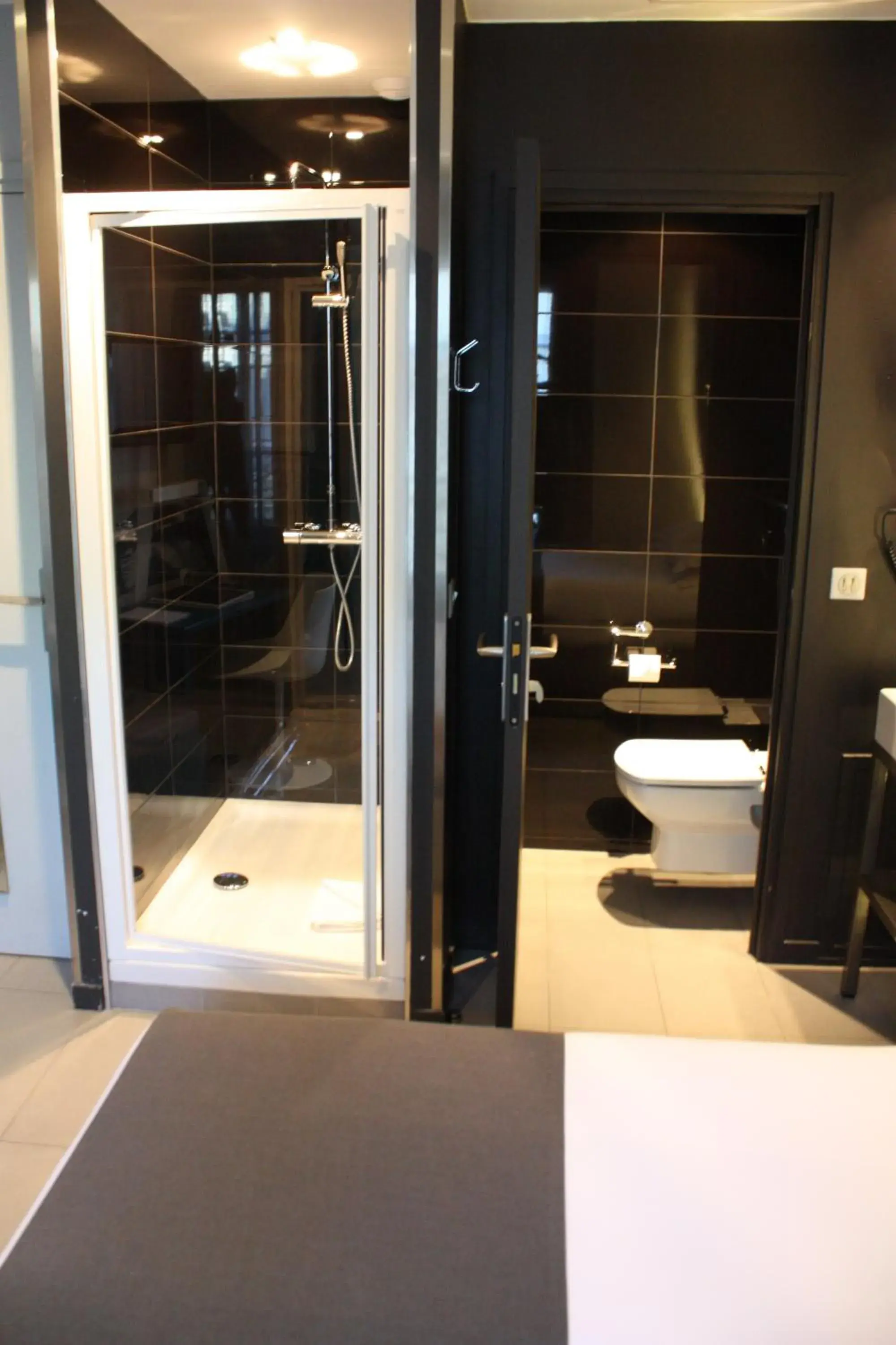 Photo of the whole room, Bathroom in Arc De Triomphe Etoile Hotel
