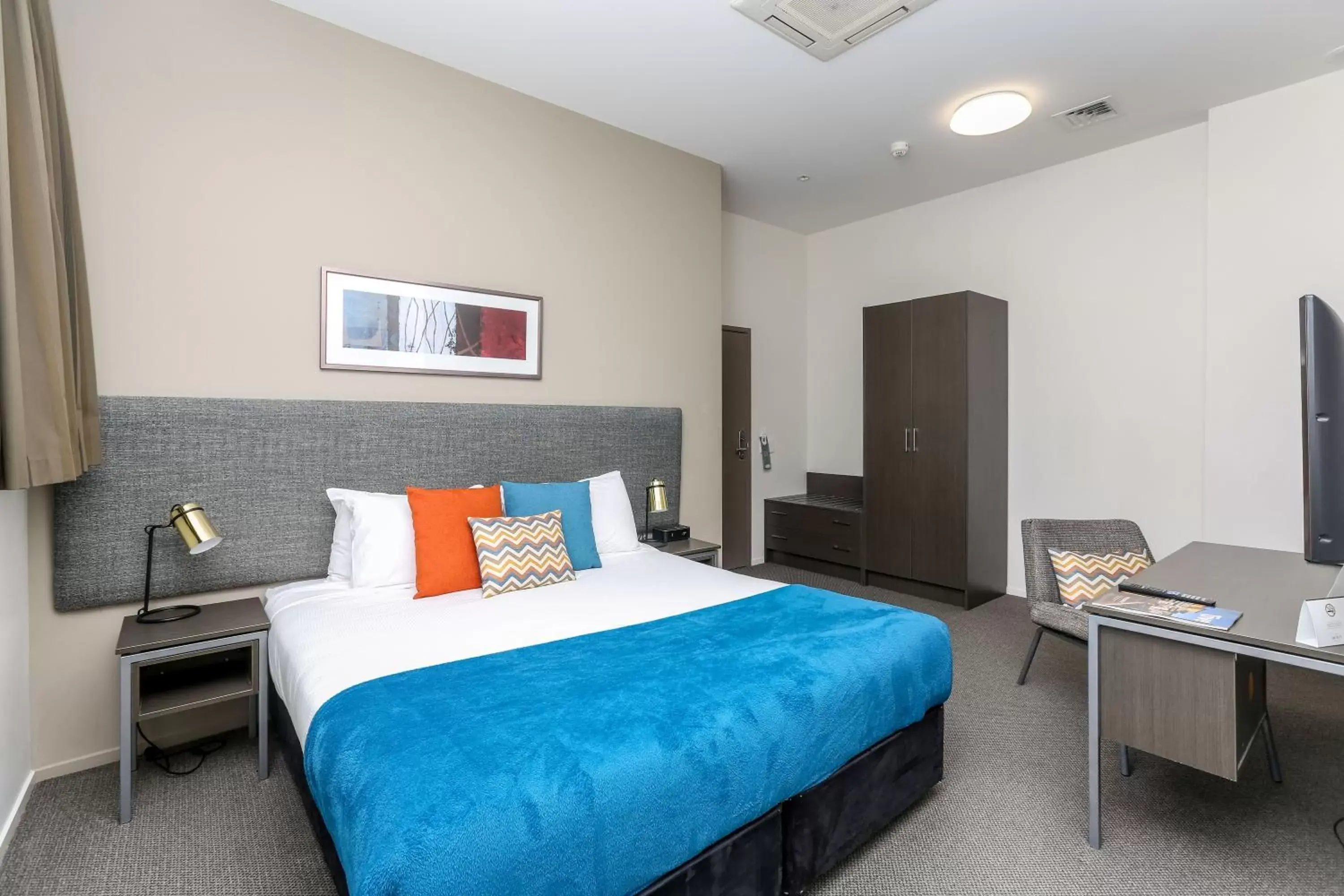 Living room, Bed in Quest New Plymouth Serviced Apartments