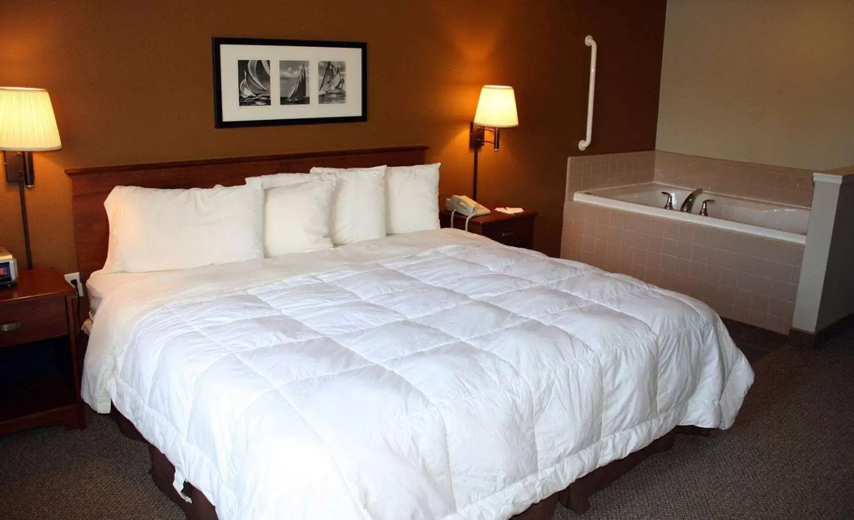 Photo of the whole room, Bed in AmericInn by Wyndham Charlevoix