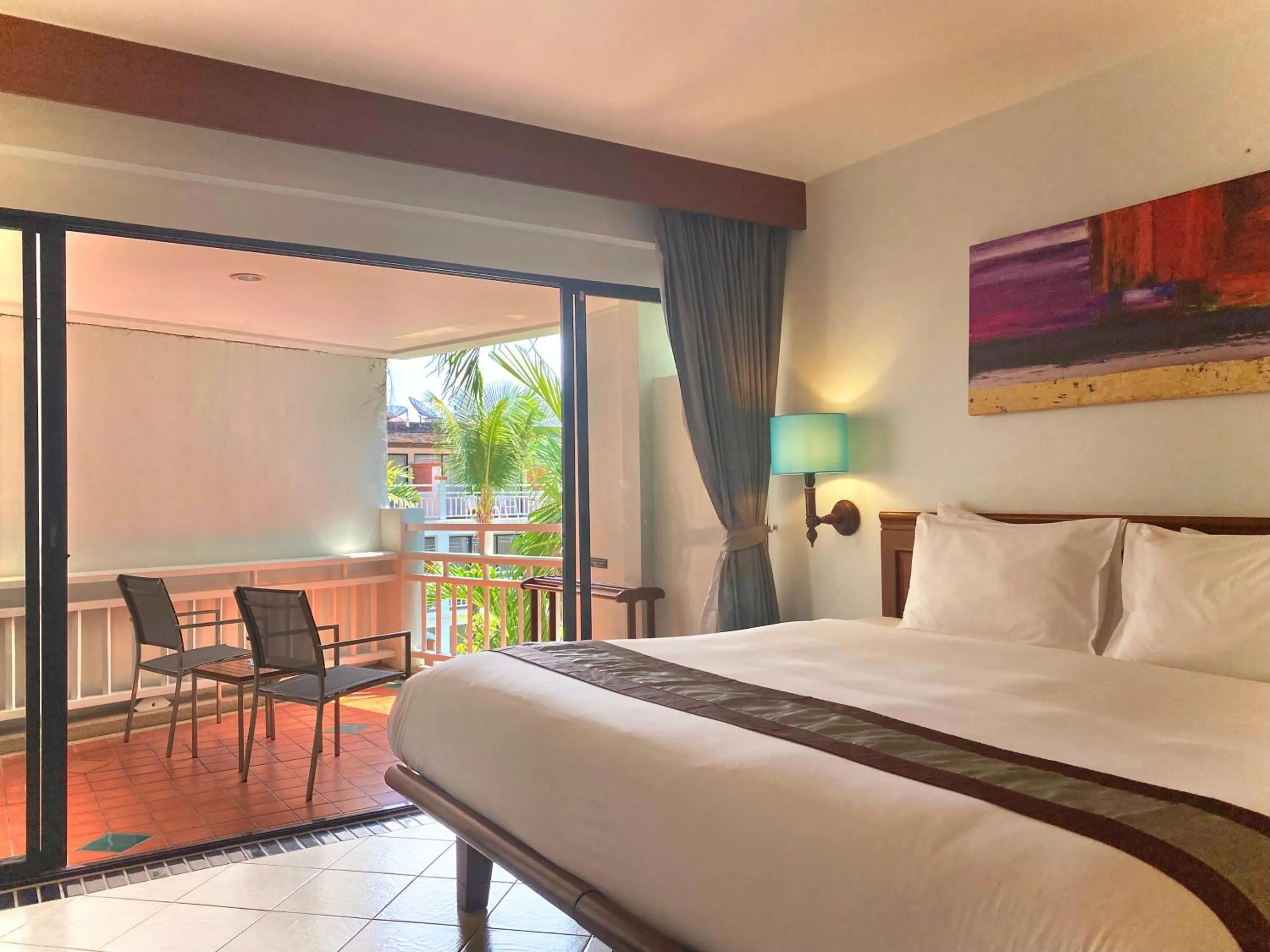 Balcony/Terrace, Bed in Sunset Beach Resort