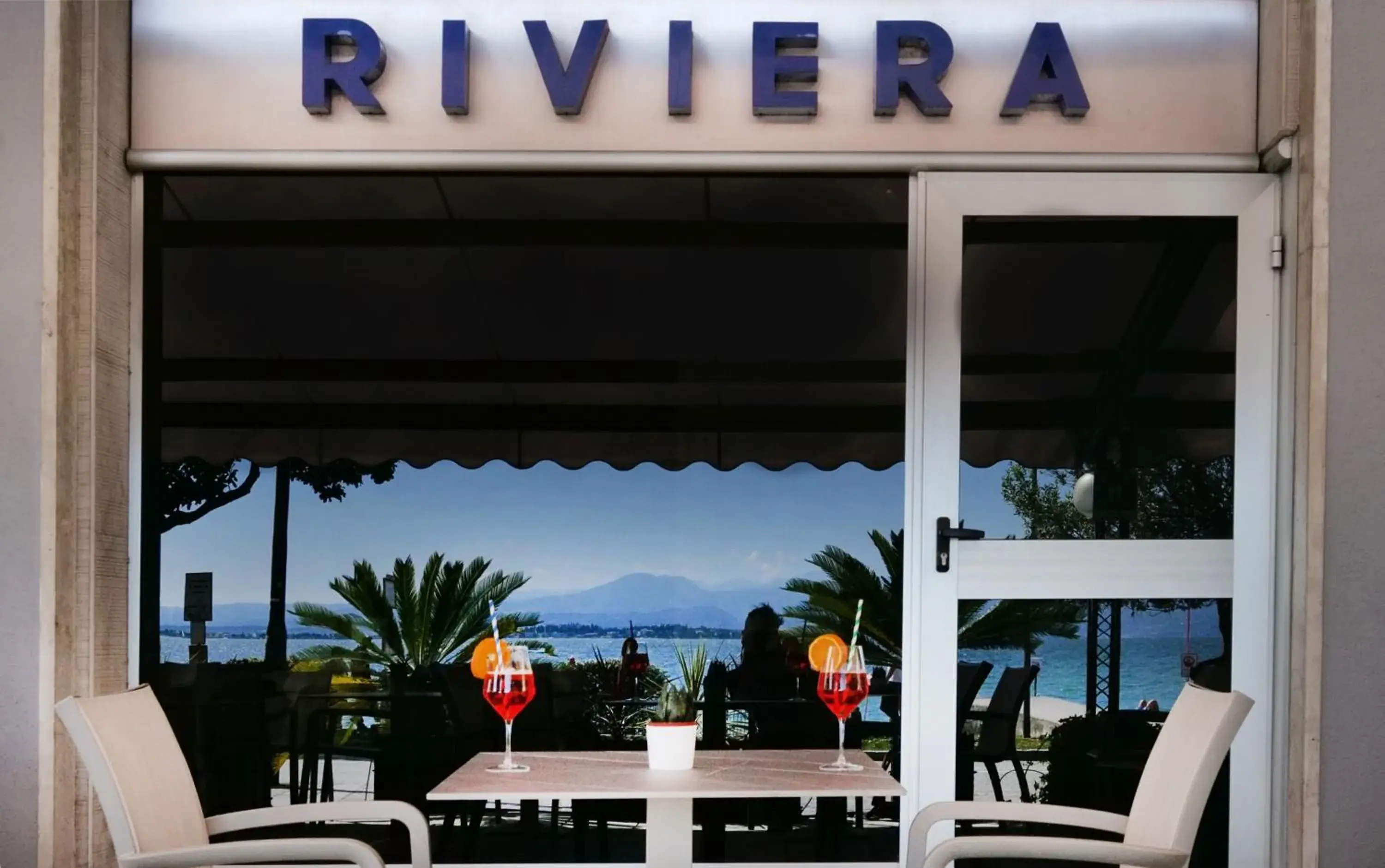 Property logo or sign in Hotel Riviera