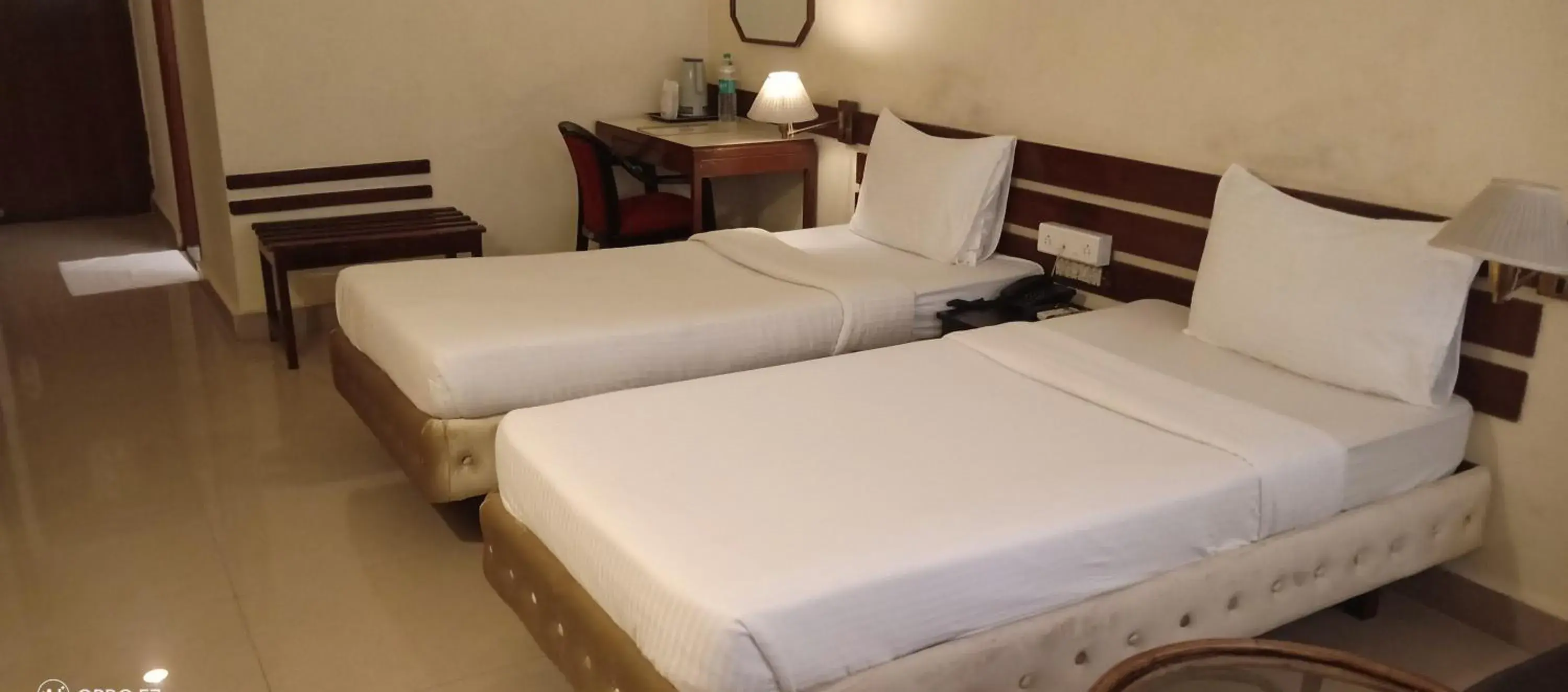 Bed in Hotel Poonja International