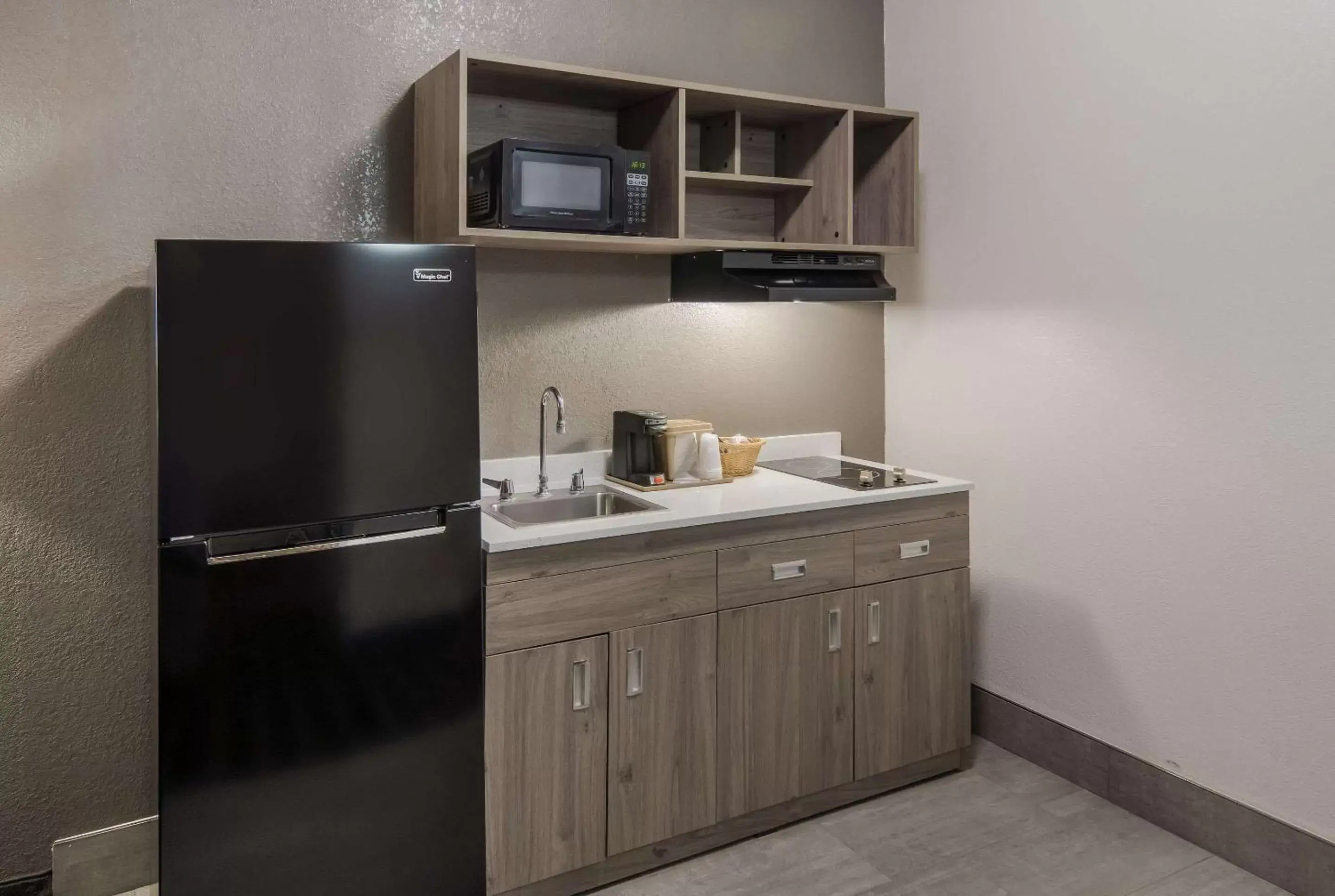 Bedroom, Kitchen/Kitchenette in Quality Inn & Suites