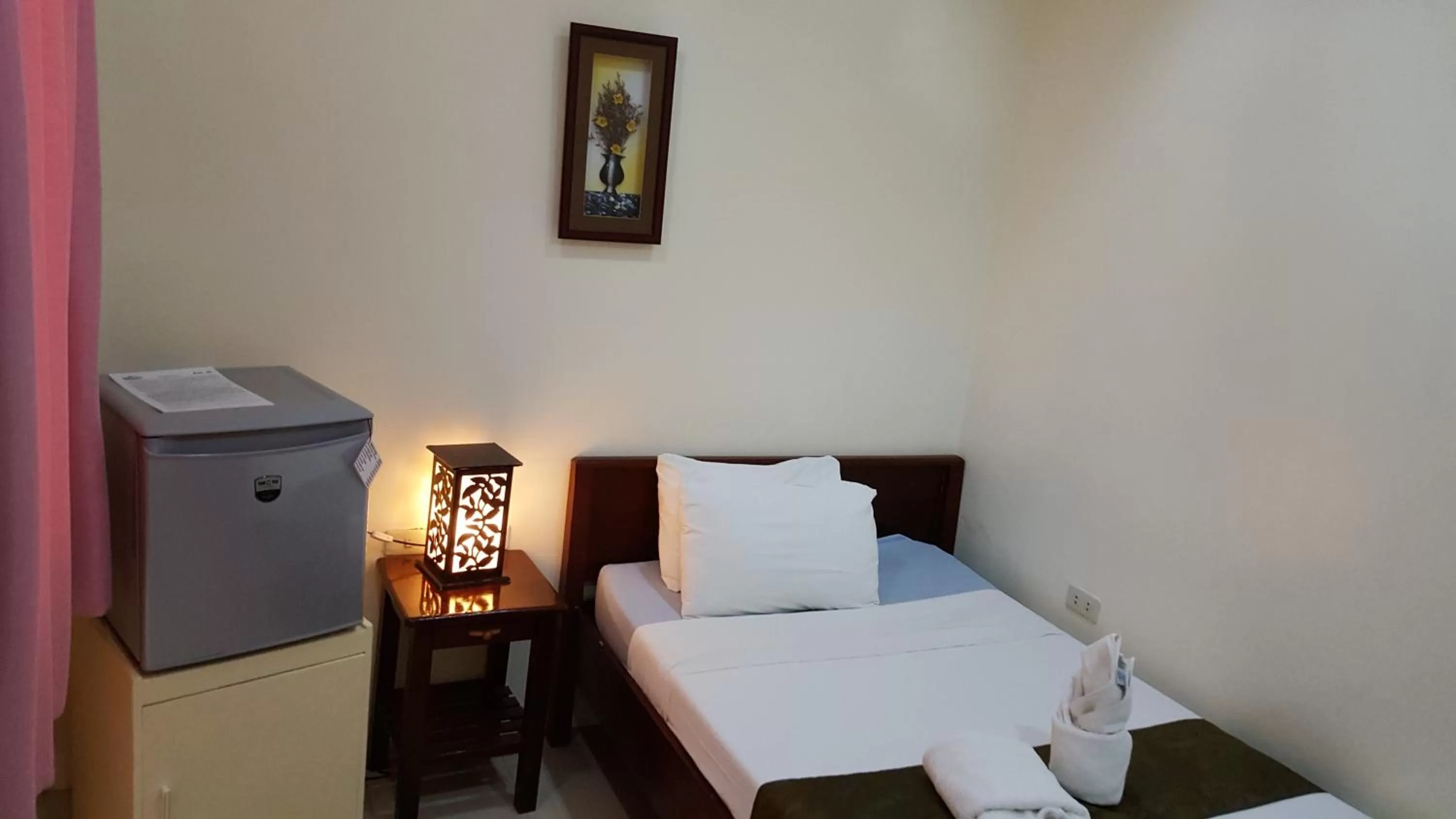 Bed in Blue Lagoon Inn & Suites