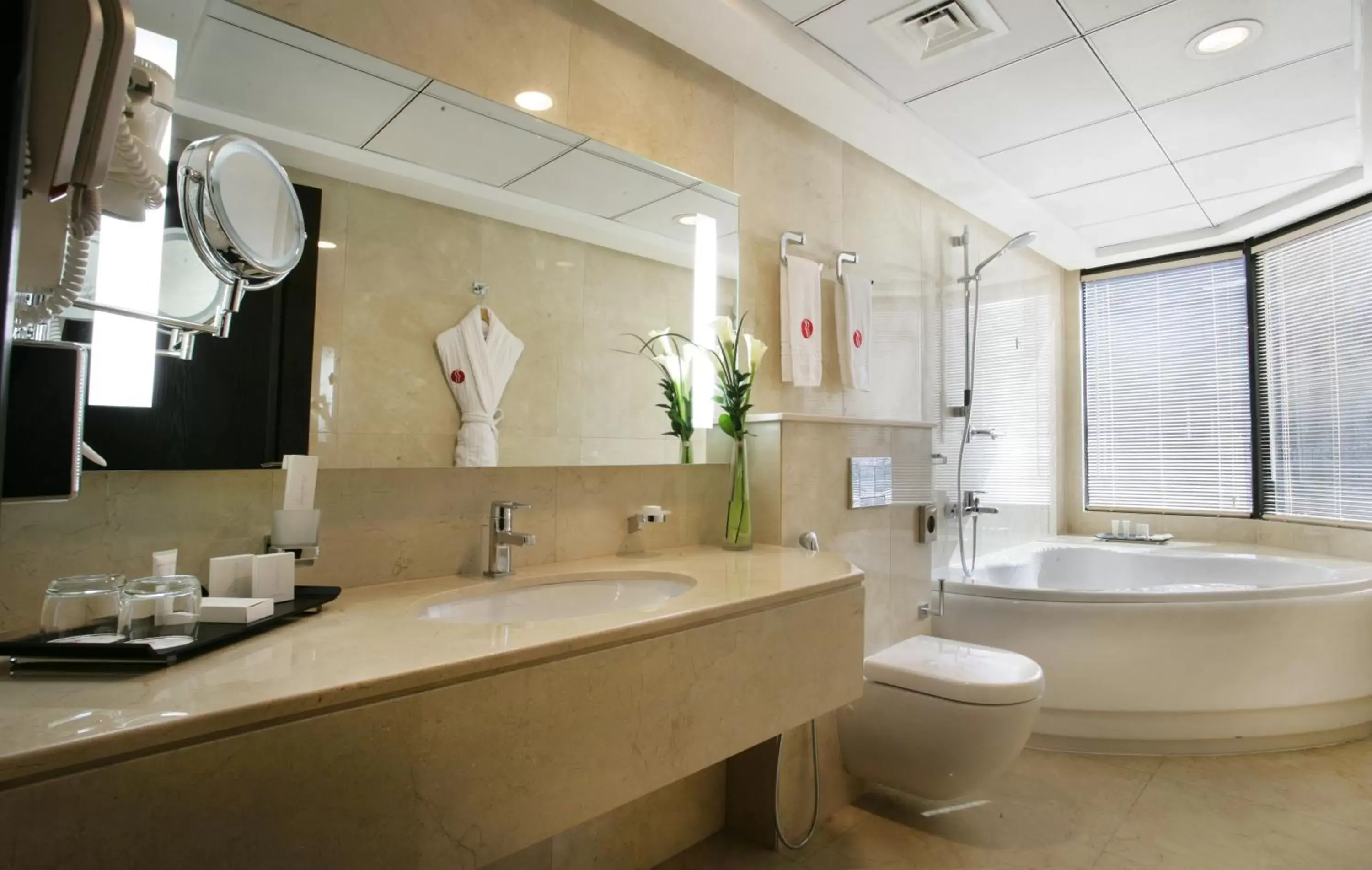Bathroom in Ramada Hotel & Suites by Wyndham Ajman