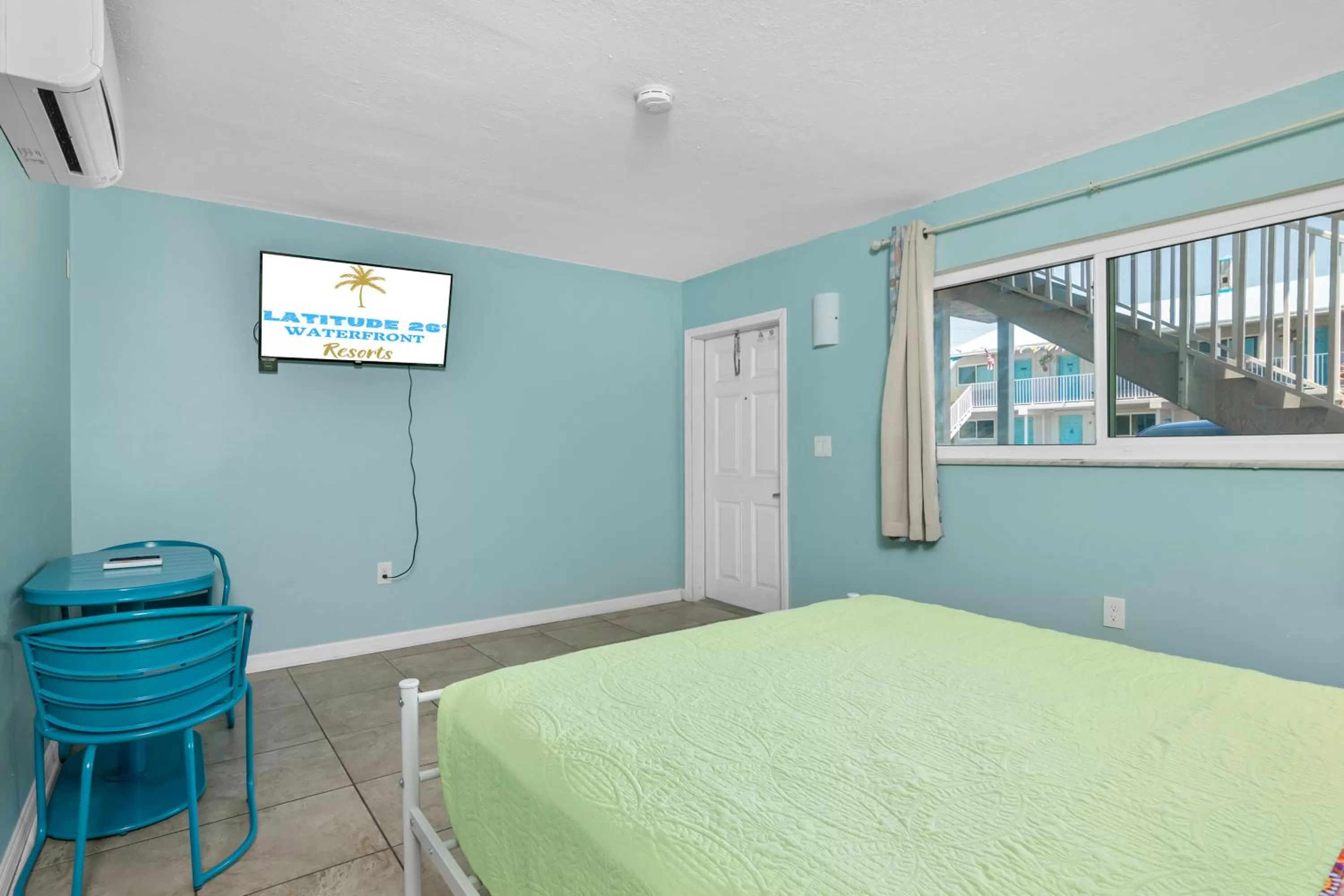 Bed in Latitude 26 Waterfront Resort and Marina
