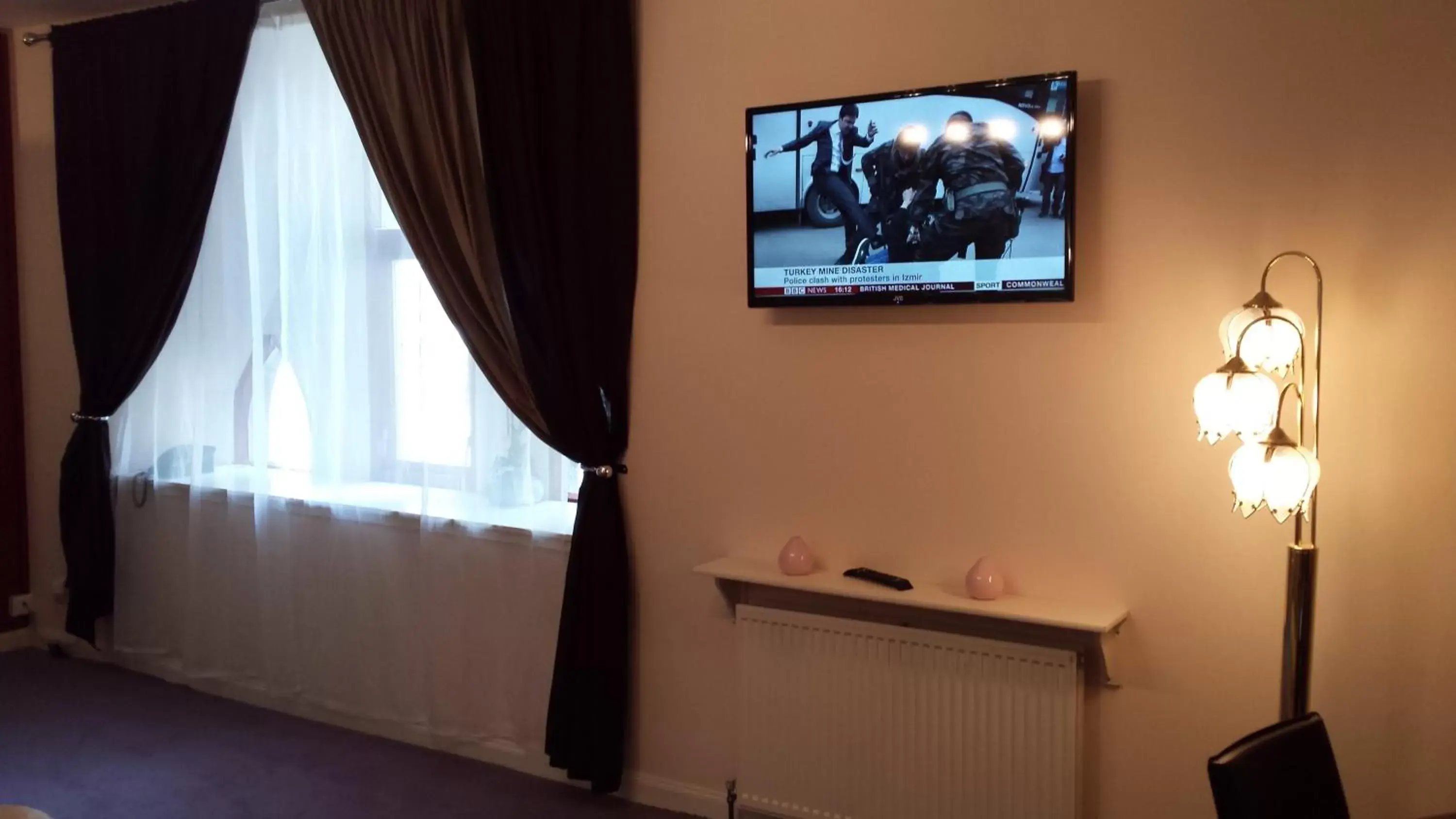 Living room, TV/Entertainment Center in Rosemount Palace