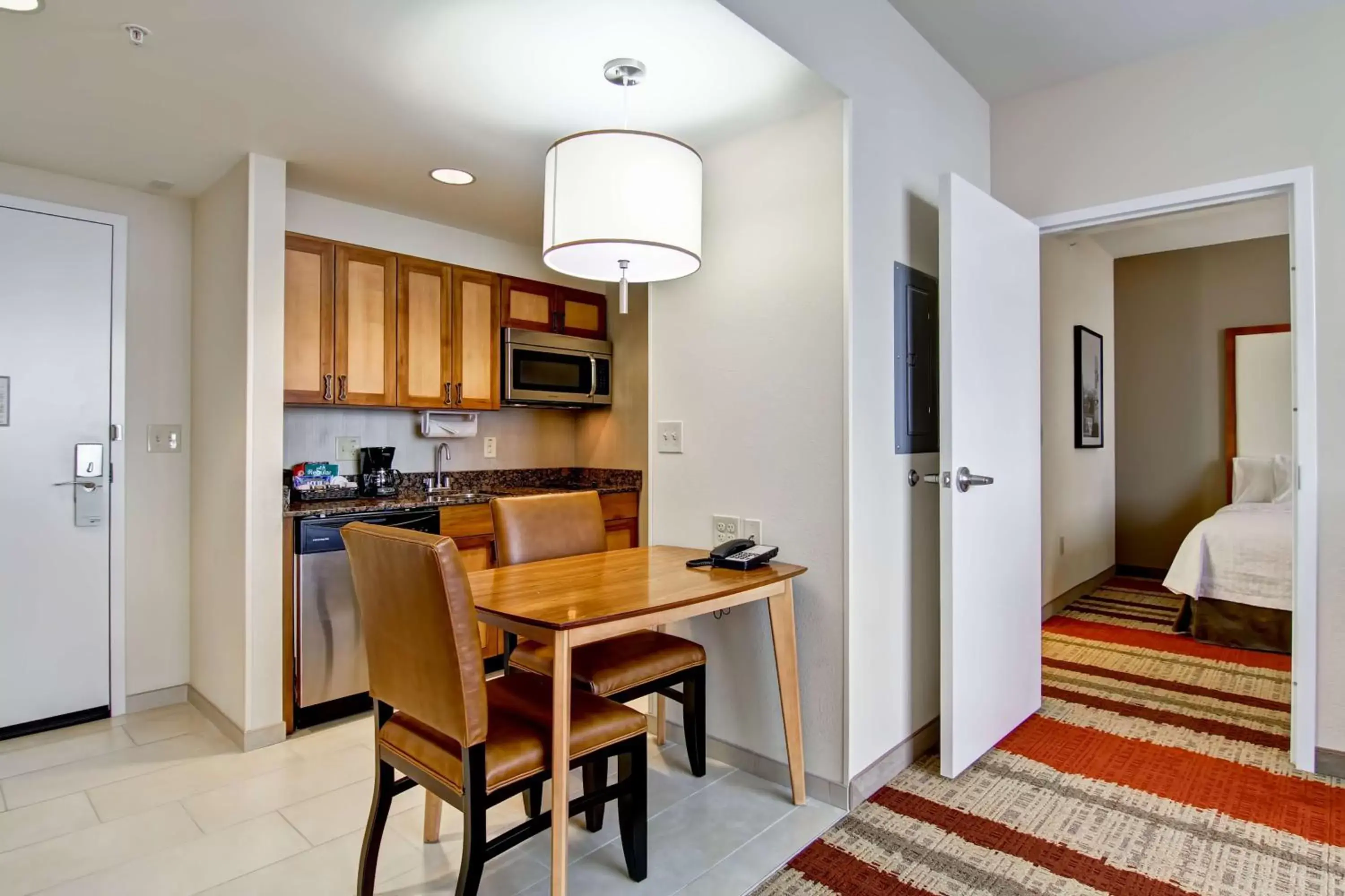 Bed, Dining Area in Homewood Suites by Hilton Cincinnati-Downtown