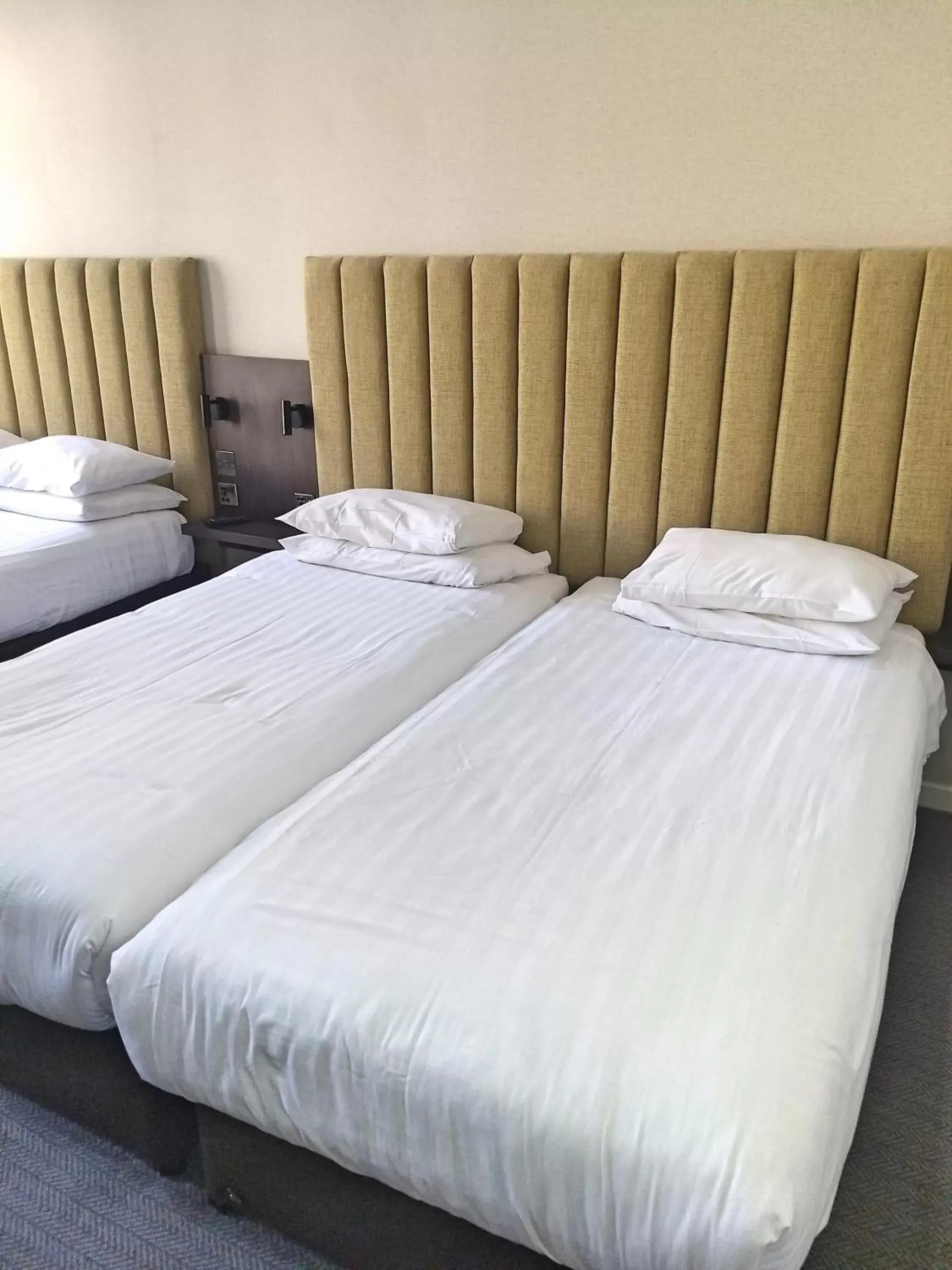 Bed in Garden Court Hotel