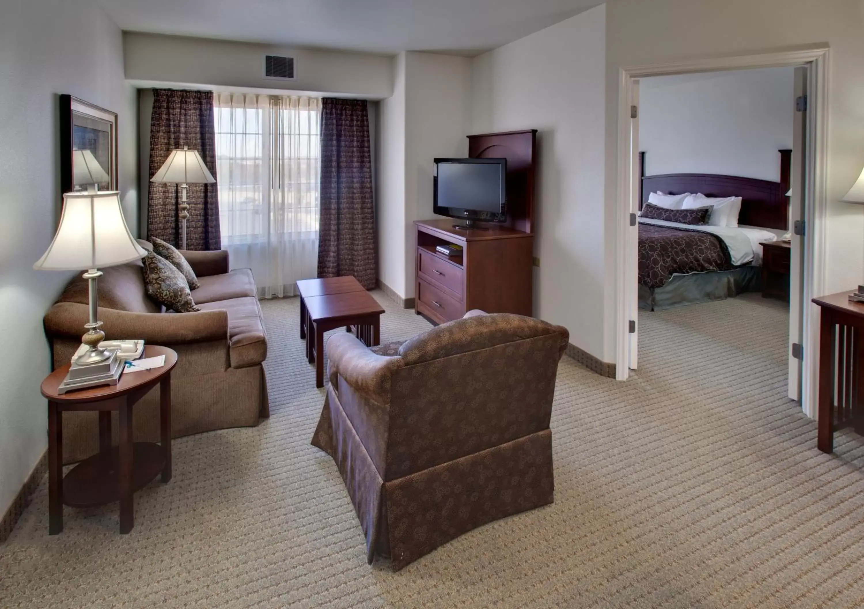 Living room, Seating Area in Staybridge Suites Rockford, an IHG Hotel