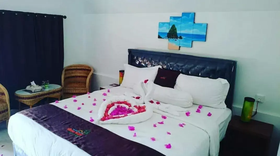 Bed in Madu Tiga Beach & Resort