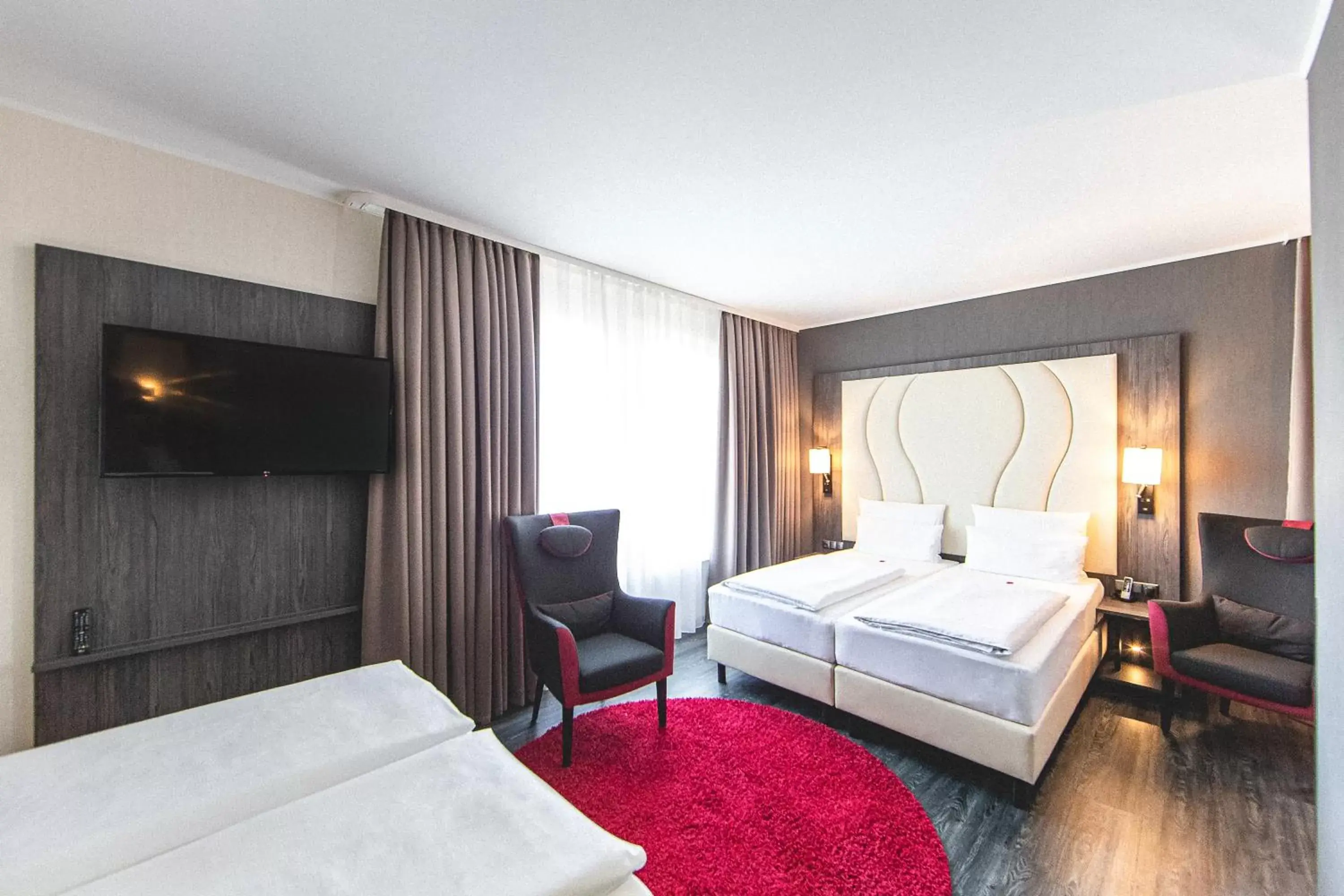 Photo of the whole room, Bed in PLAZA Premium Parkhotel Norderstedt