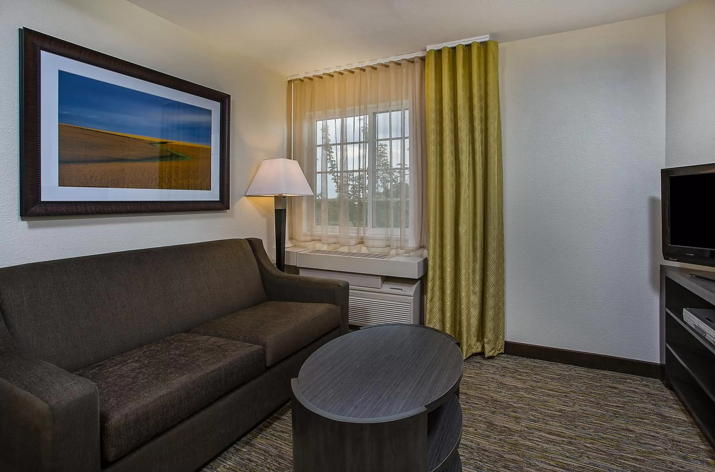 Bedroom, Seating Area in Candlewood Suites Louisville Airport, an IHG Hotel
