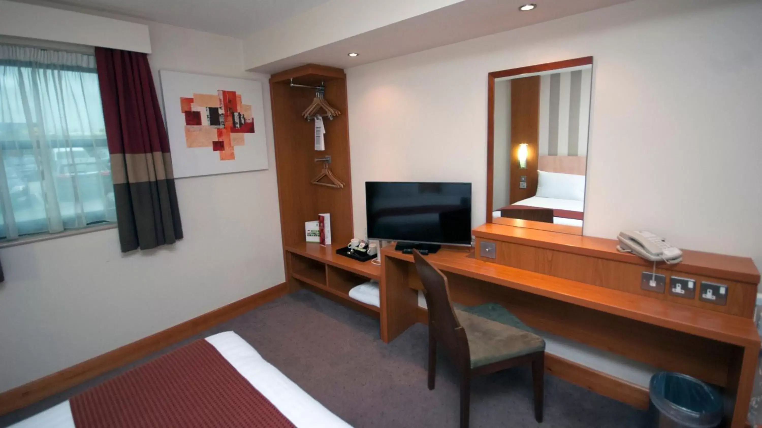 TV and multimedia, TV/Entertainment Center in Holiday Inn Manchester - Central Park, an IHG Hotel