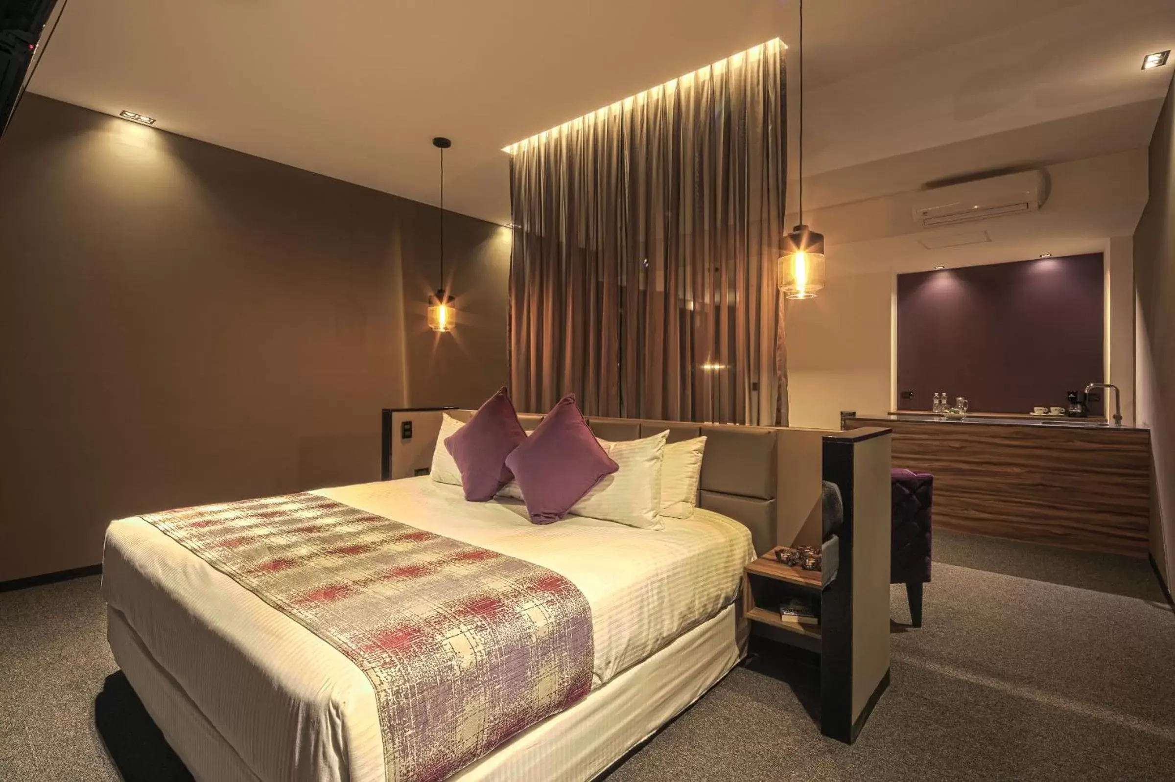 Bed in Kharma Suites