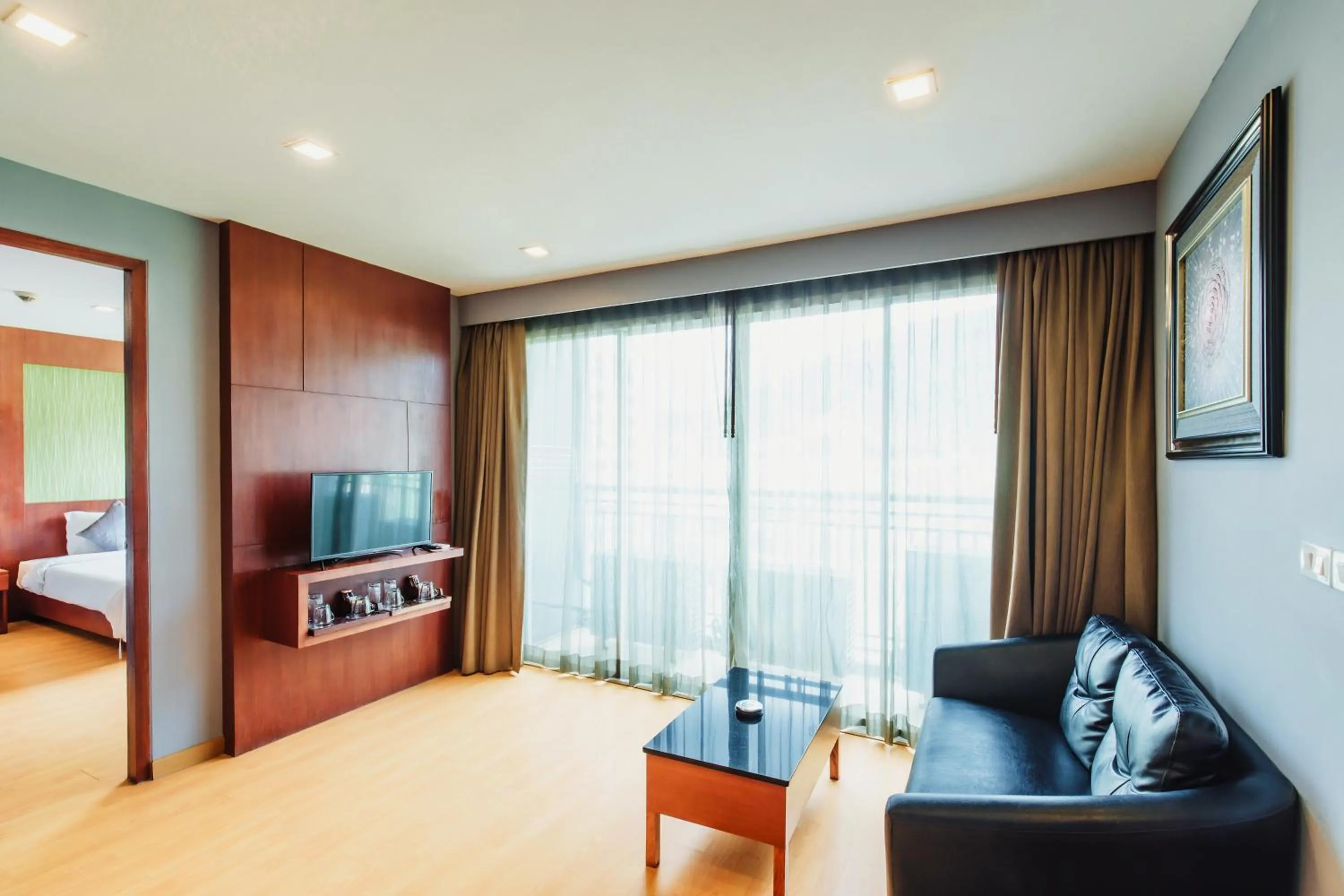 Living room, Bed in Elite Suites Patong