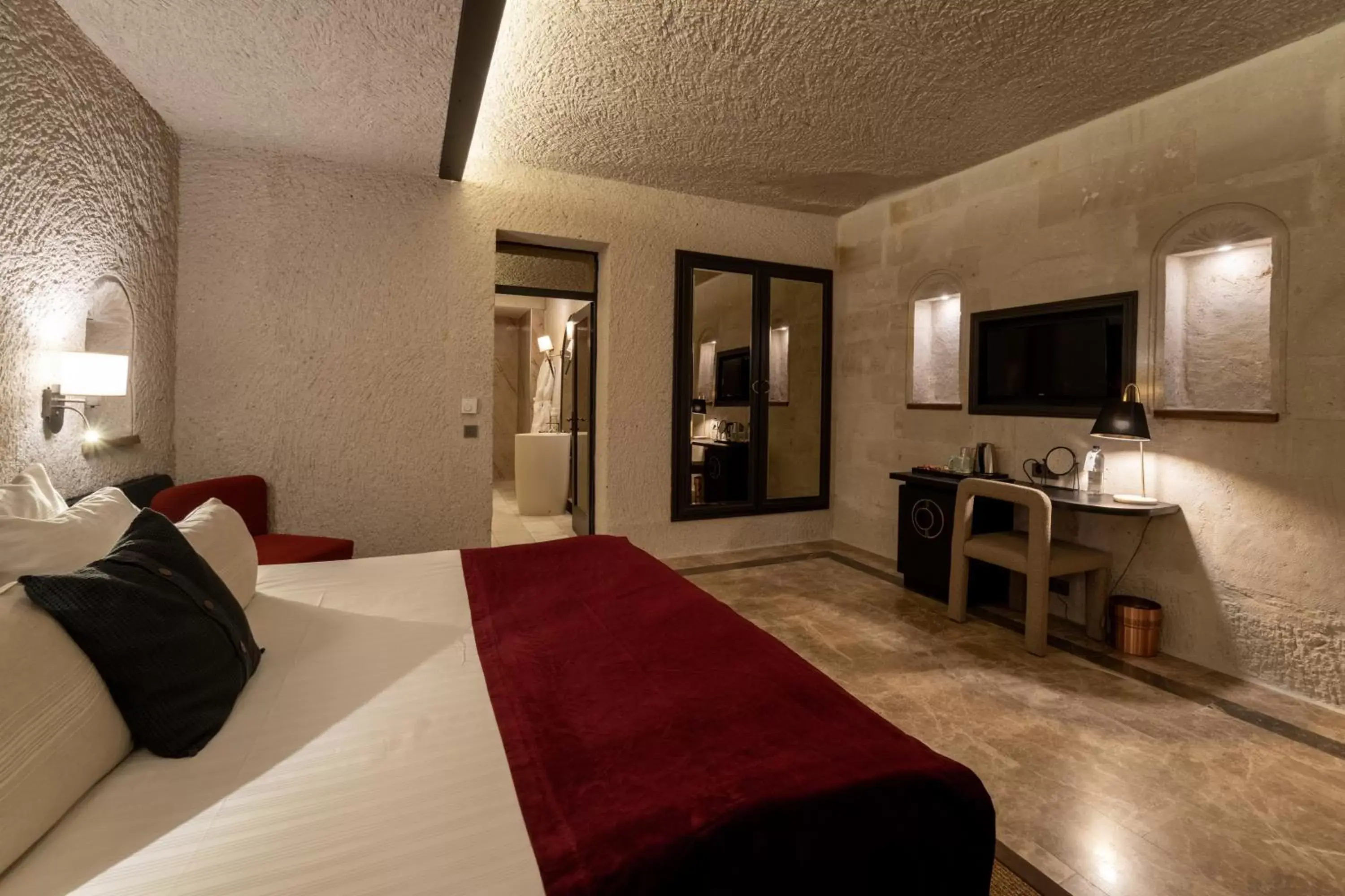 Bedroom, TV/Entertainment Center in Artemis Cave Suites & Spa- Adults Only