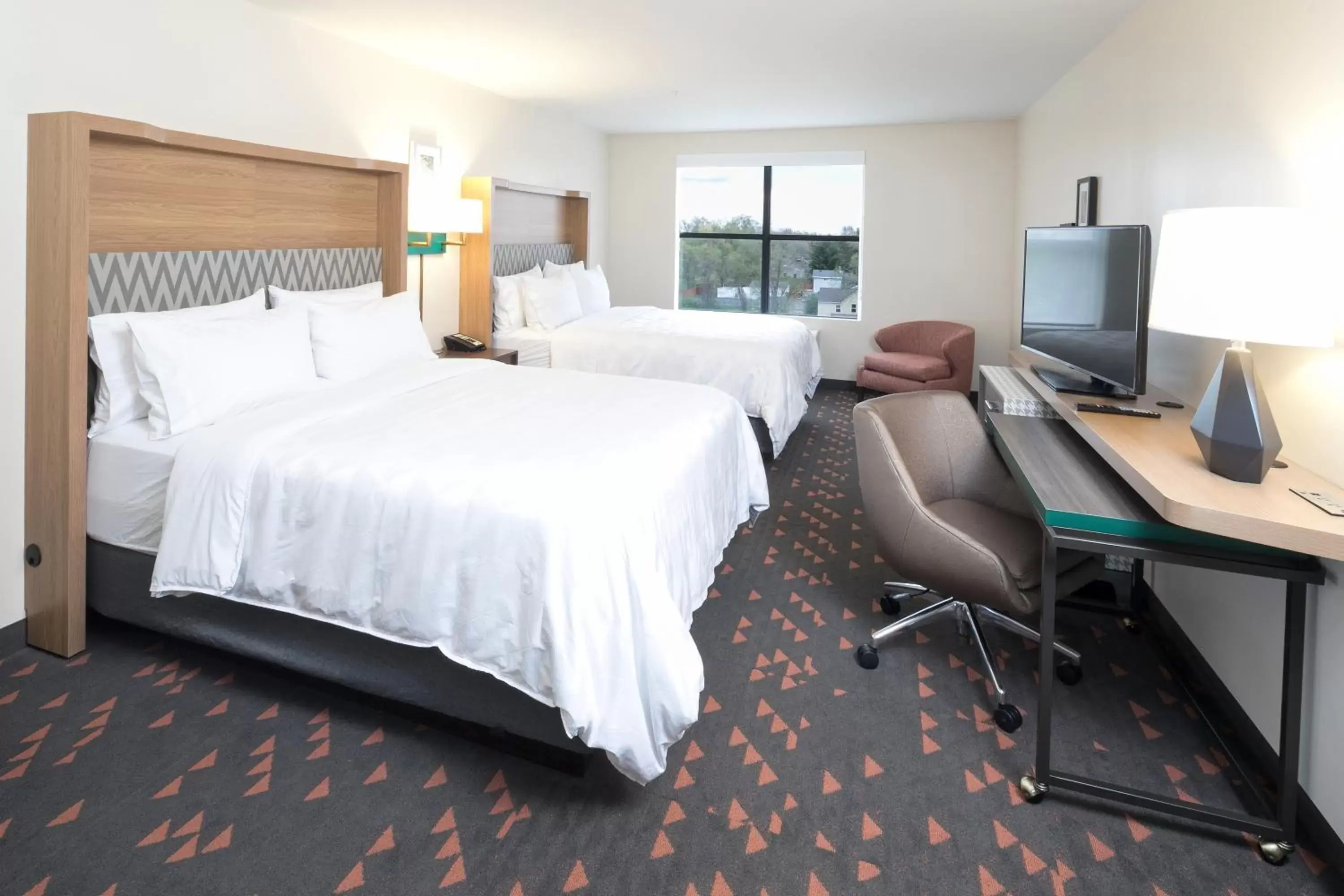 Bed in Holiday Inn & Suites Detroit - Troy, an IHG Hotel