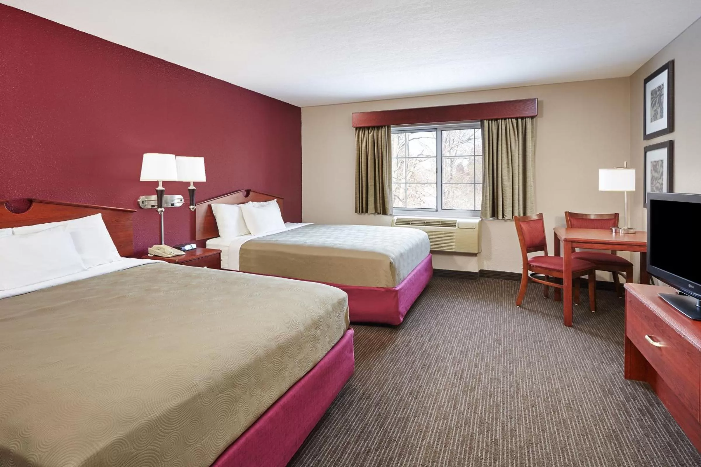 Bed in AmericInn by Wyndham Douglas/Saugatuck