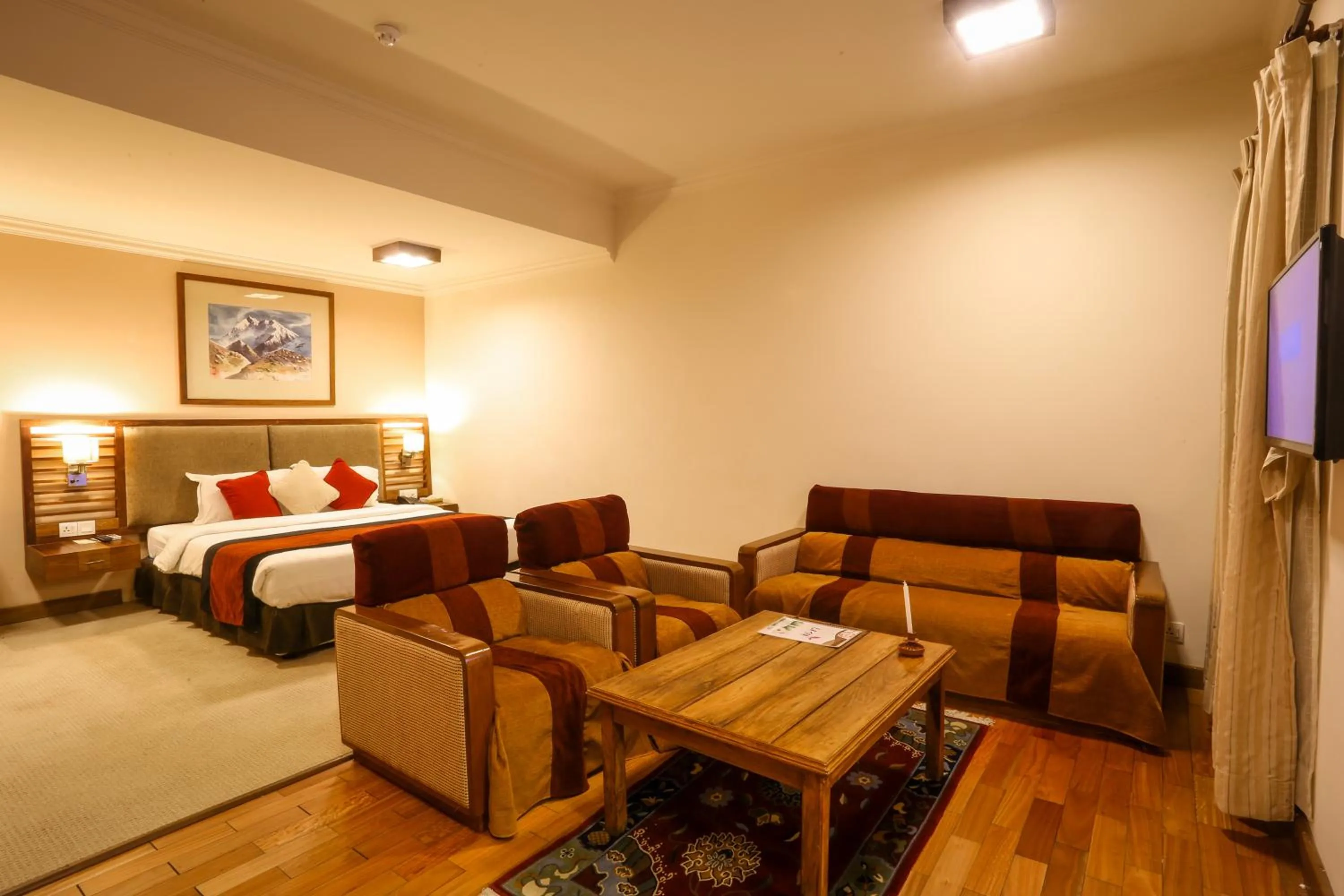 Seating area, Bed in Atithi Resort & Spa