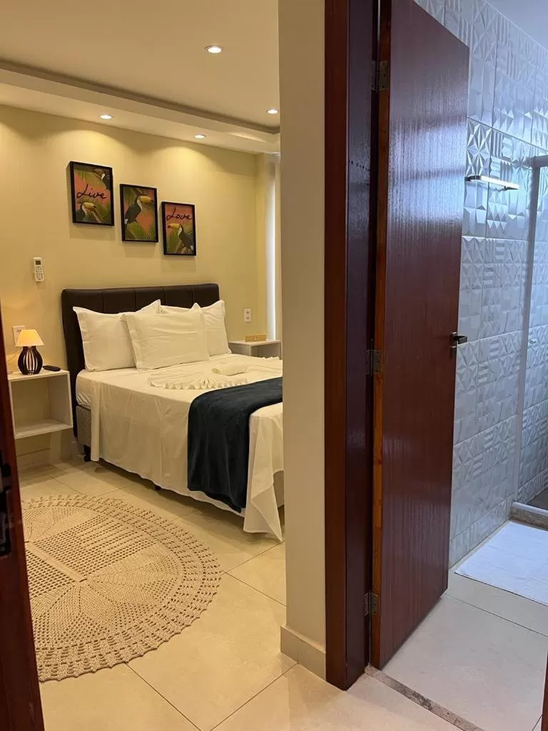 Bed in Pousada Arraial Tropical