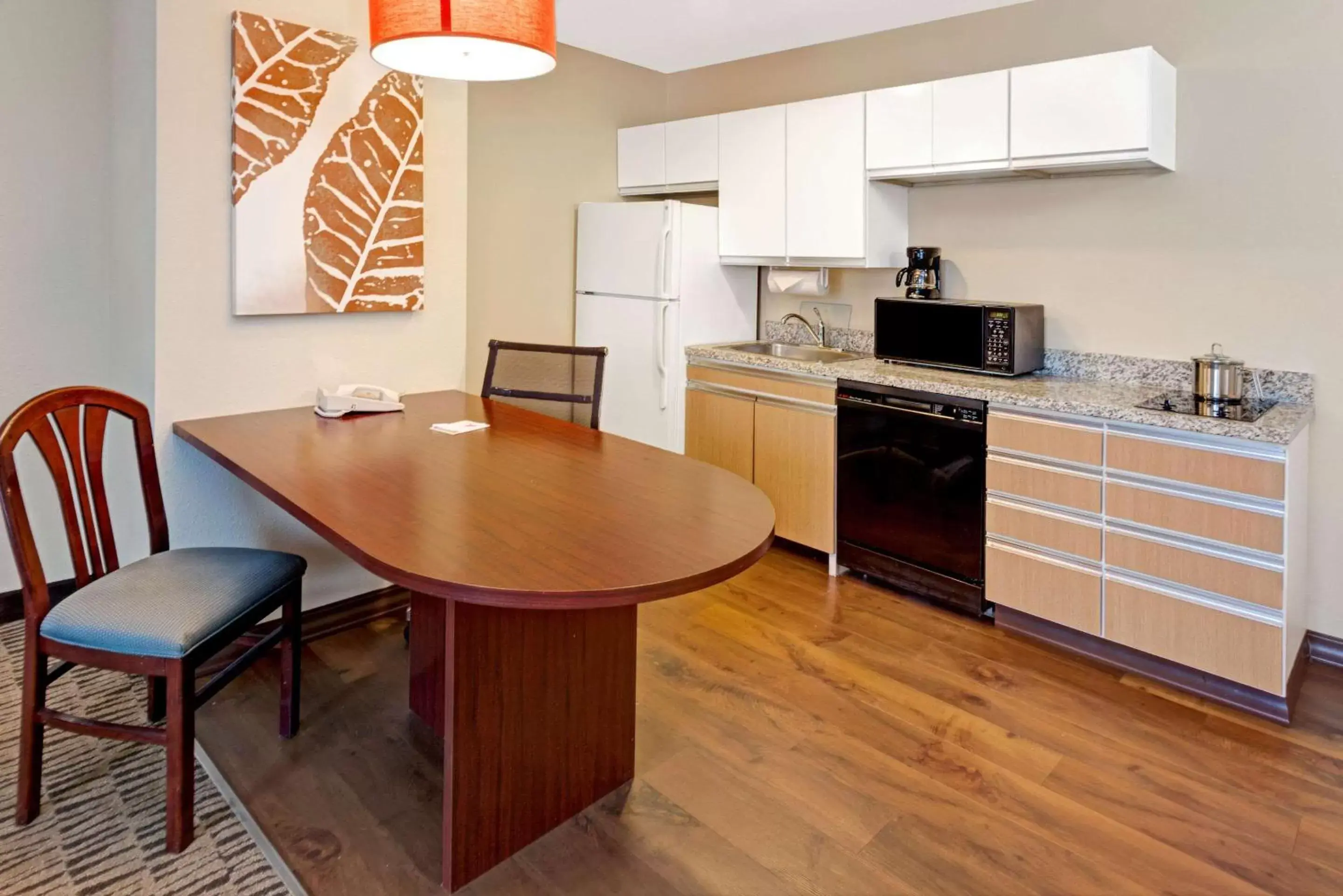 Bedroom, Kitchen/Kitchenette in MainStay Suites Orlando Altamonte Springs