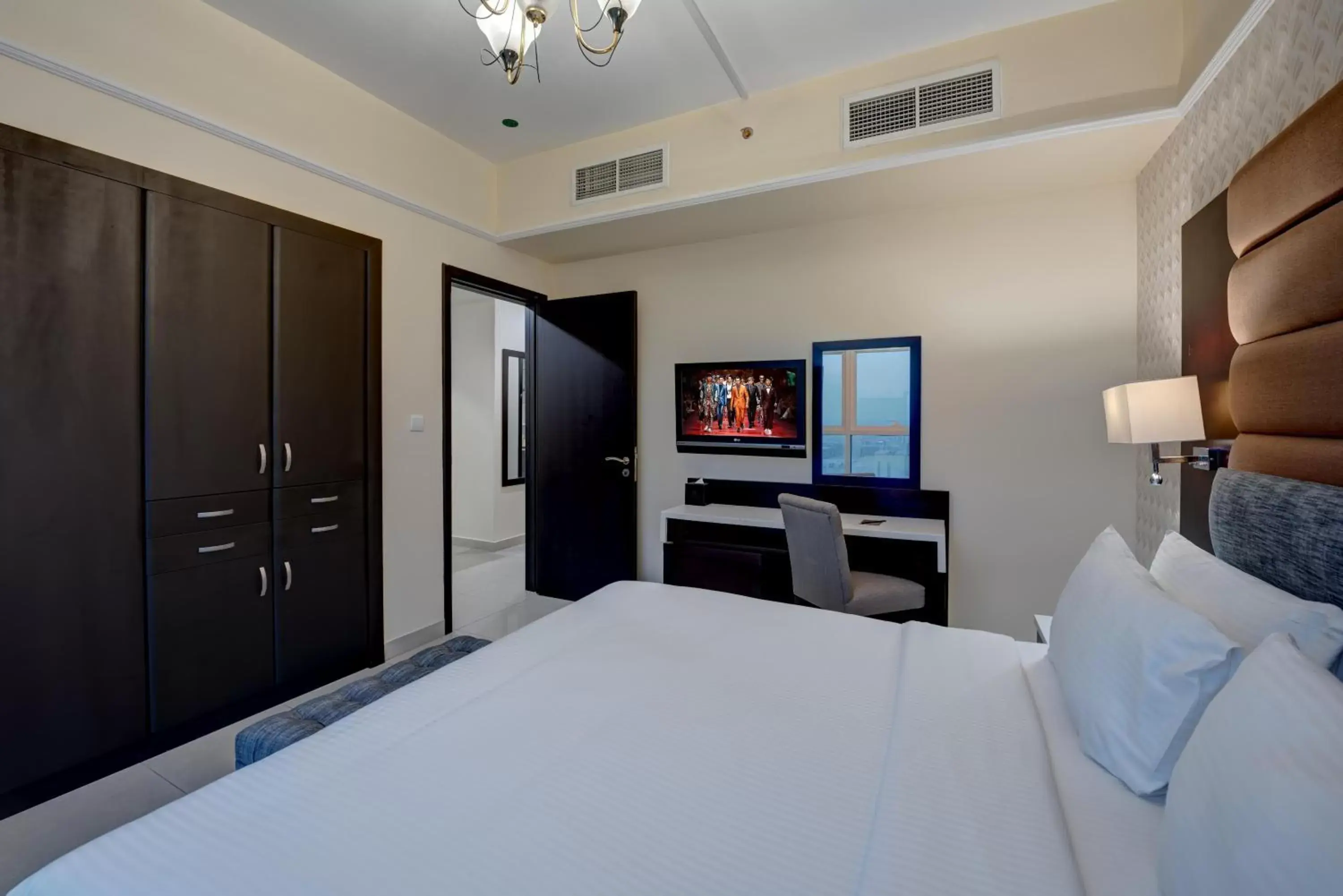Bedroom, TV/Entertainment Center in Emirates Grand Hotel